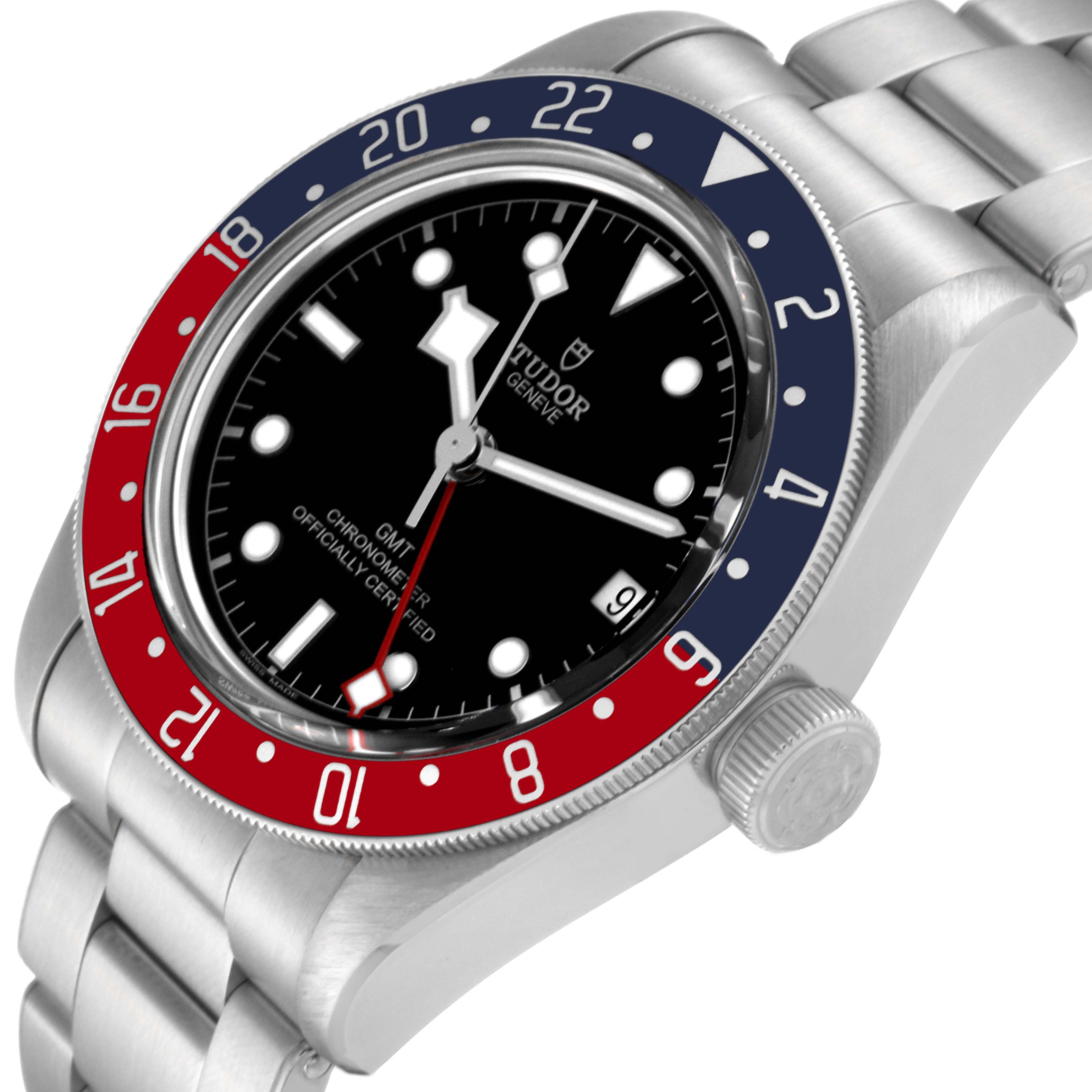 The image shows a close-up of the Tudor Heritage Black Bay 79830RB Men
s Stainless Steel Black Dial 79830RB Men
s Stainless Steel Black Dial watch, focusing on its dial, bezel, and part of the stainless steel bracelet.