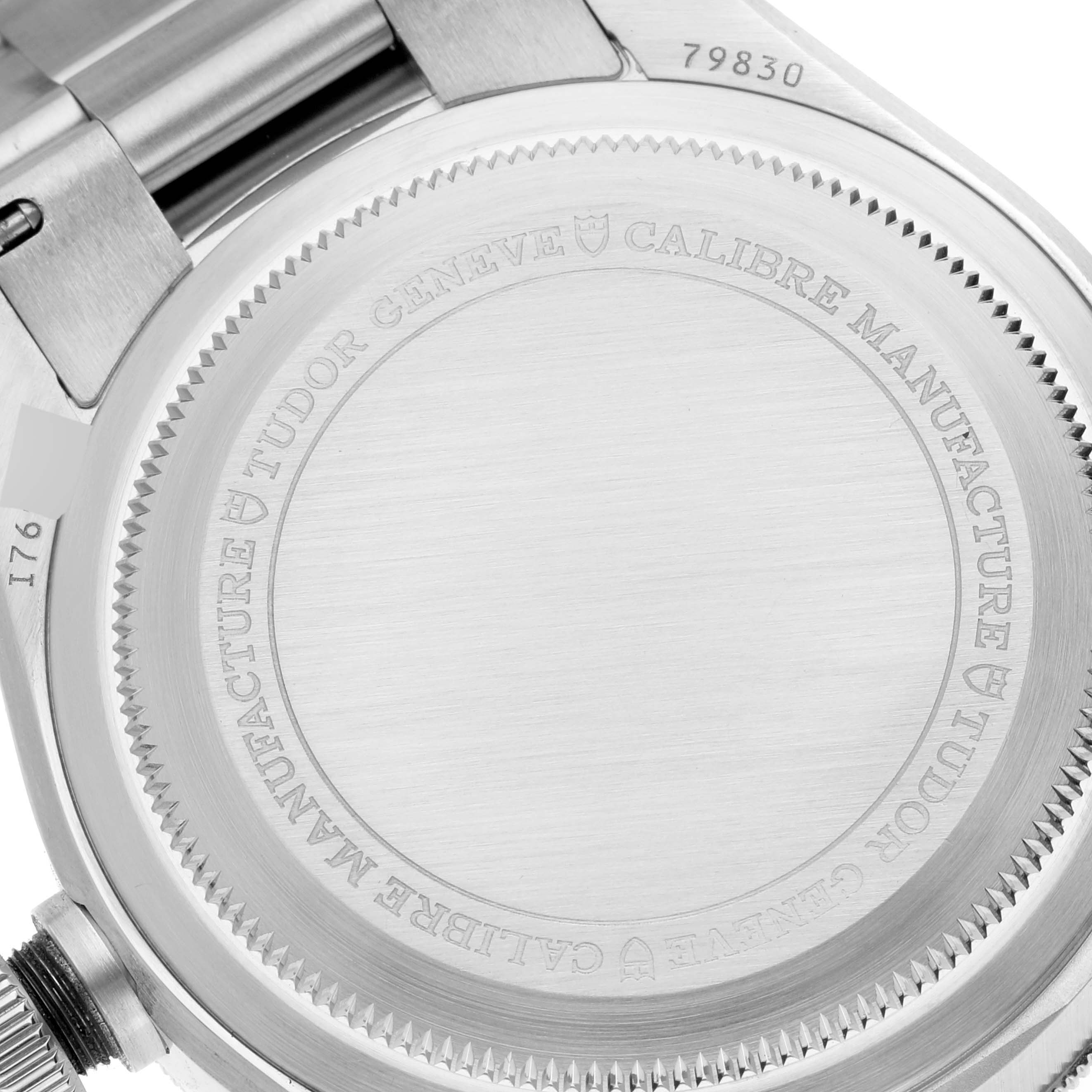 The image shows the case back and part of the bracelet of a Tudor Heritage Black Bay 79830RB Men
s Stainless Steel Black Dial 79830RB Men
s Stainless Steel Black Dial watch.