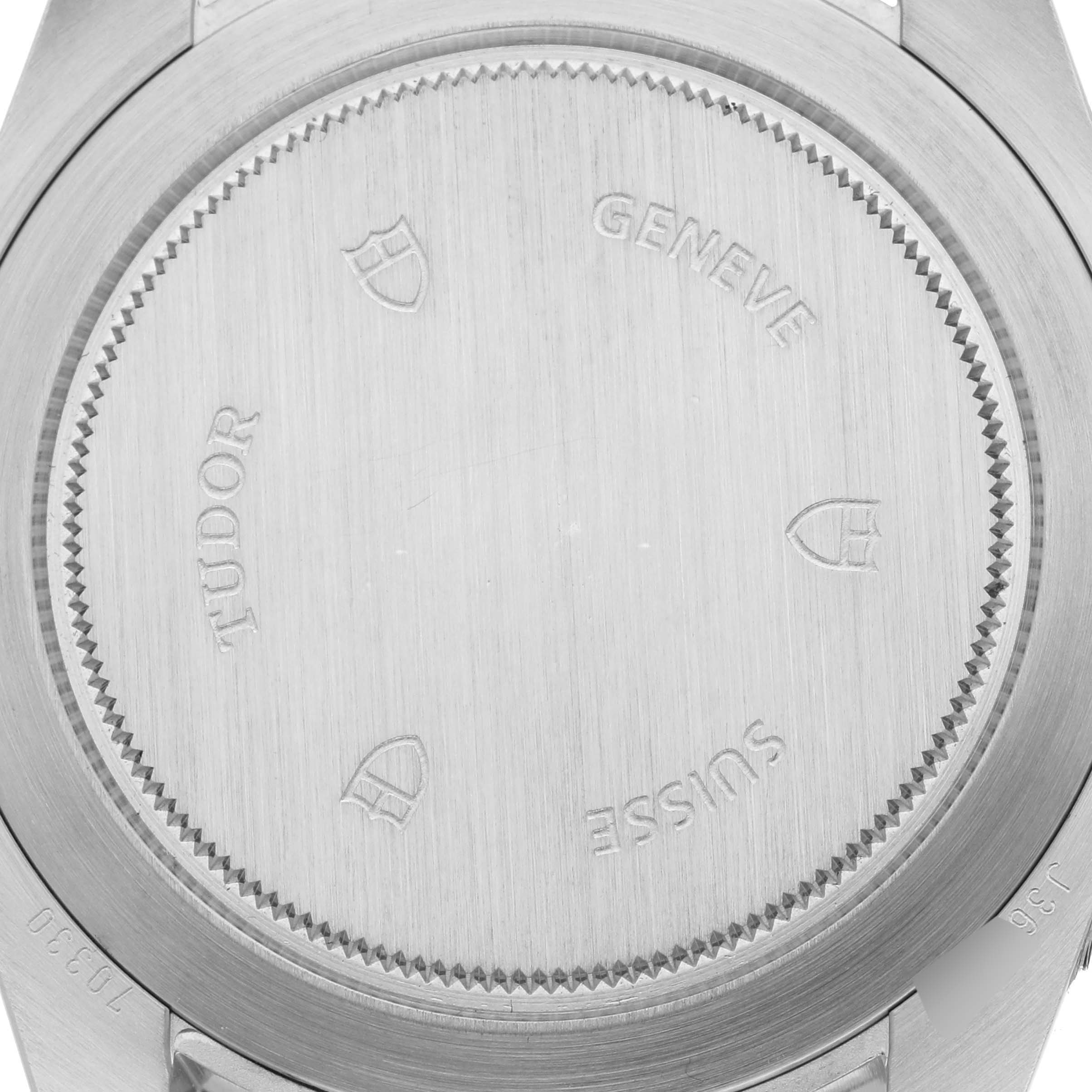 The image shows the back case of a Tudor Heritage Chrono 70330N Men's Stainless Steel Grey Dial 70330N Men's Stainless Steel Grey Dial watch, featuring engravings and logo details.