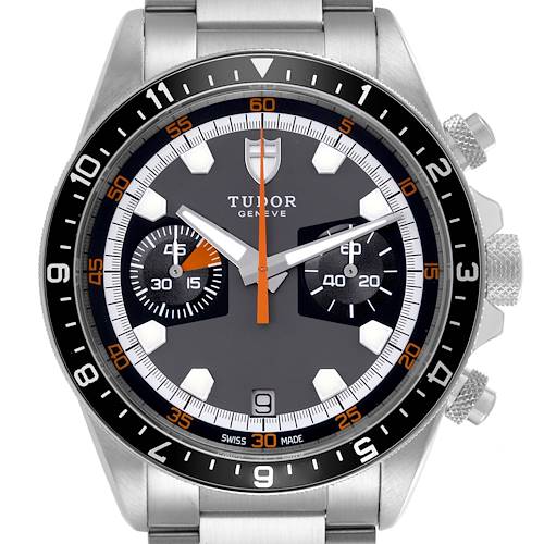 The Tudor Heritage Chrono watch is shown from a front angle, displaying its face, bezel, and pushers.
