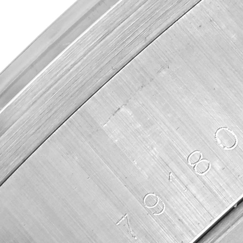 The image shows a close-up side view of the casing of a Tudor Prince 79180 Men's Stainless Steel Silver Dial watch, highlighting its serial and model numbers.