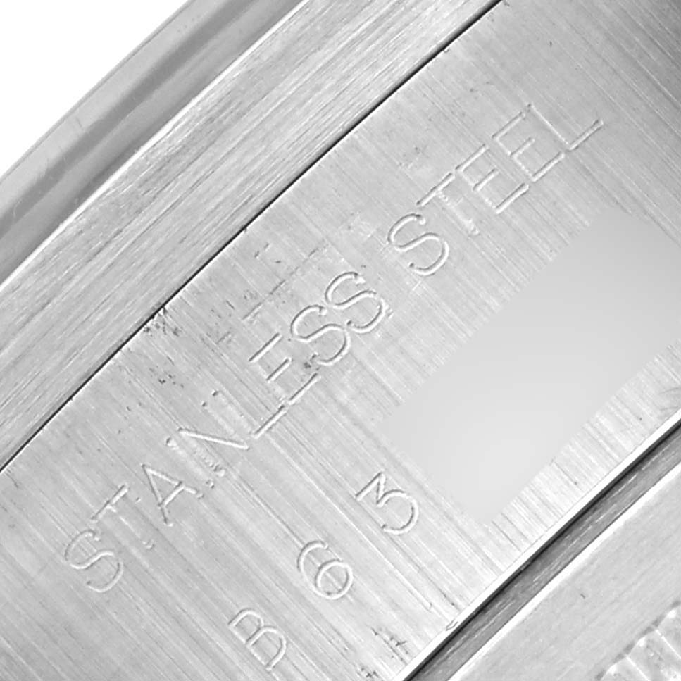 The image shows a close-up of the stainless steel case back of the Tudor Prince 79180 Men's Stainless Steel Silver Dial watch.