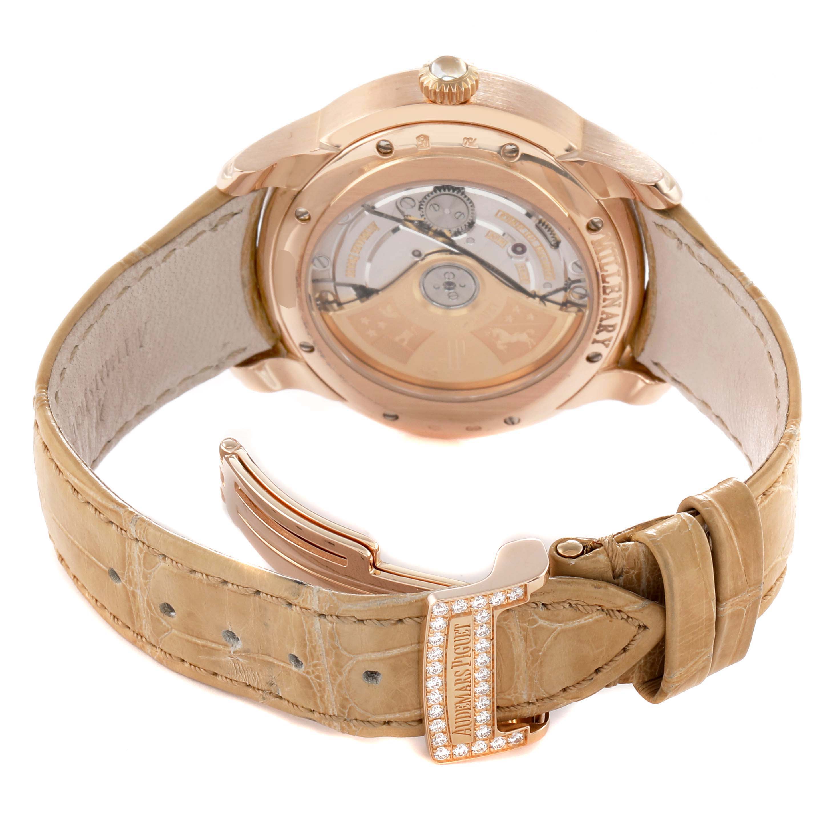 The image shows the back of the Audemars Piguet Millenary 77315OR Women's Rose Gold Mother of Pearl Dial watch, highlighting the movement, rose gold case, and beige leather strap with a jeweled clasp.