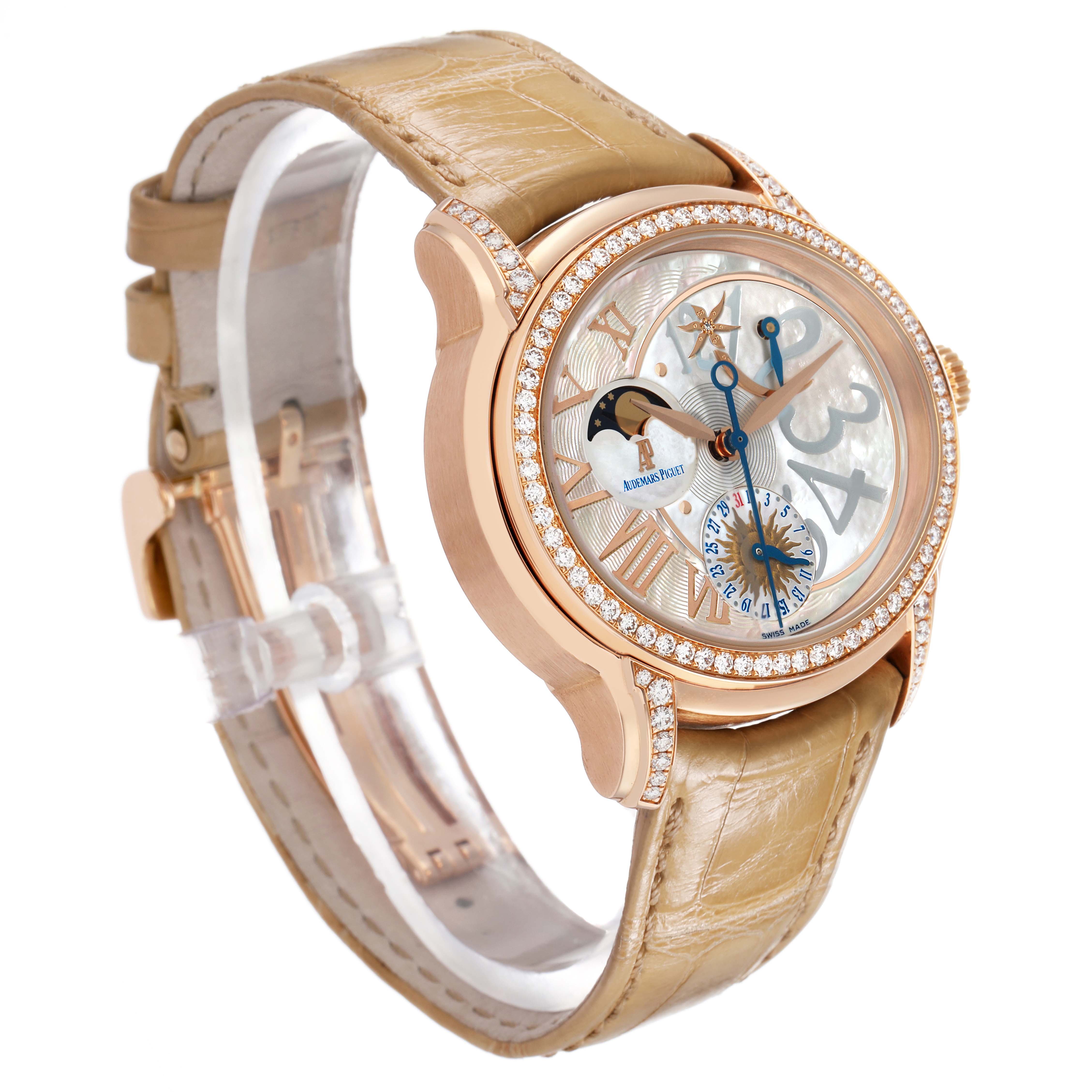 The Audemars Piguet Millenary 77315OR Women's Rose Gold Mother of Pearl Dial watch is shown at a three-quarter angle, displaying the dial, bezel with diamonds, and leather strap.