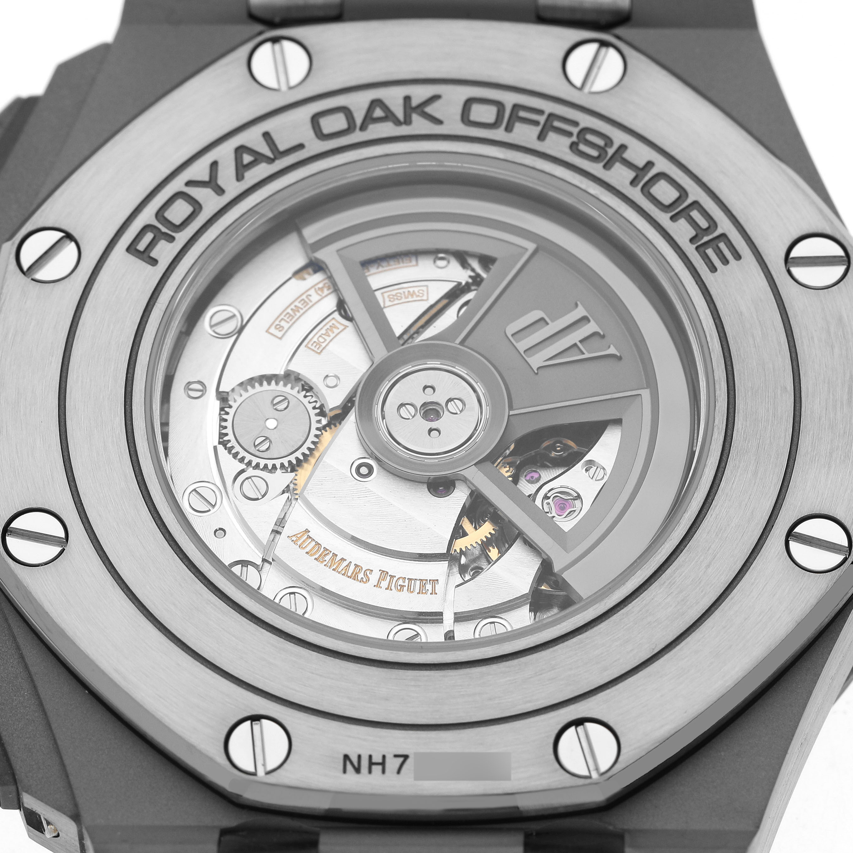 The image shows the back case of the Audemars Piguet Royal Oak Offshore 26400IO.OO.A004CA.02.A Men's Titanium Grey Dial, highlighting its intricate mechanical movement.