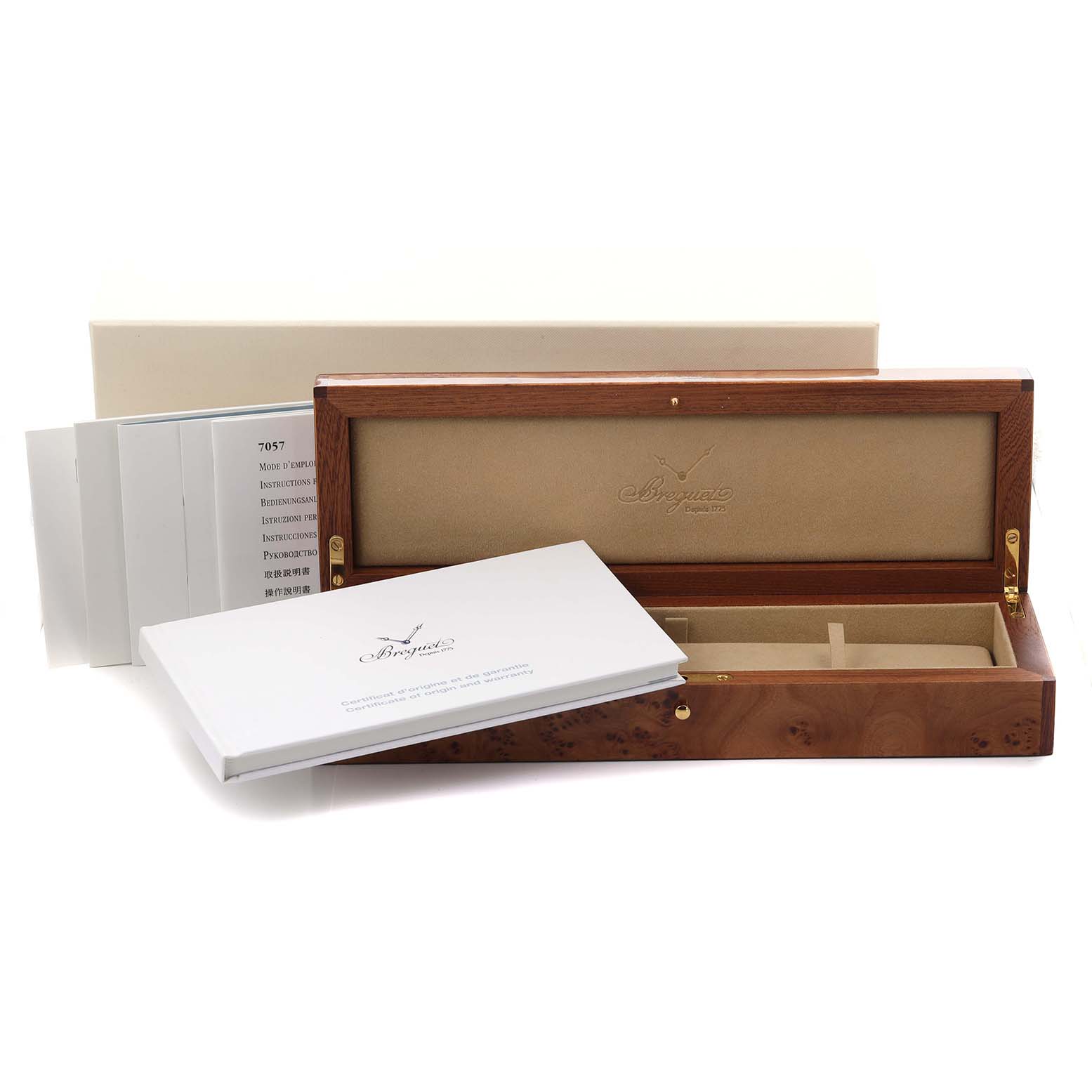 The image shows the Breguet Tradition 7057BR/G9/9W6 Men's Rose Gold Silver Dial 7057BR/G9/9W6 Men's Rose Gold Silver Dial watch box, including its open wooden case and accompanying manuals.