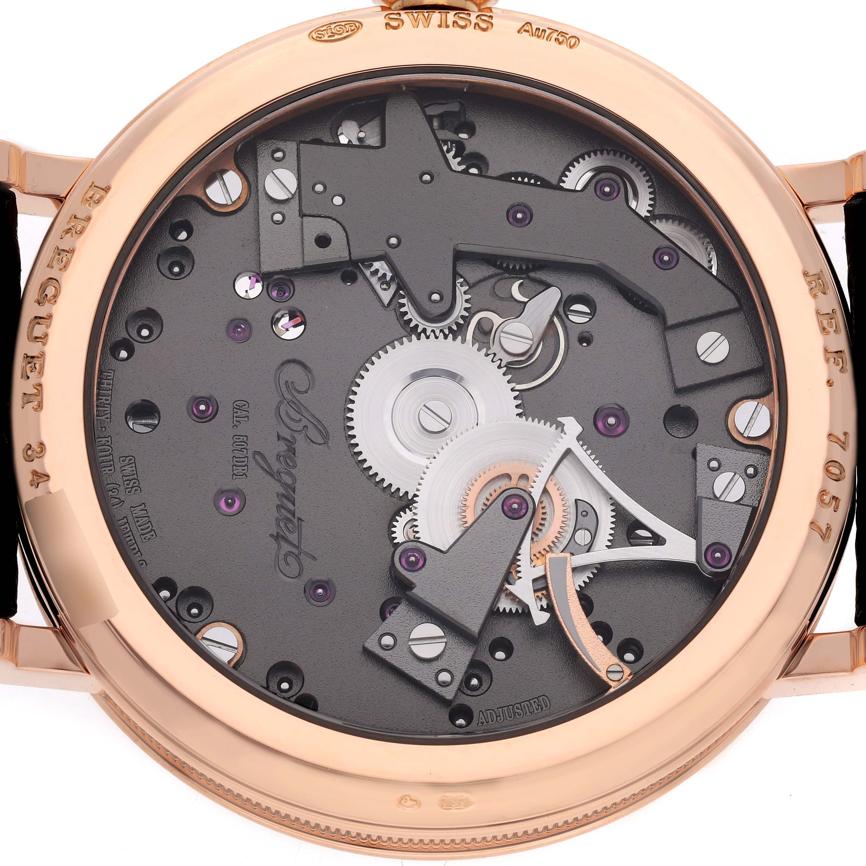 The image shows the back view of the Breguet Tradition 7057BR/G9/9W6 Men's Rose Gold Silver Dial 7057BR/G9/9W6 Men's Rose Gold Silver Dial watch, highlighting its intricate movement and gears.