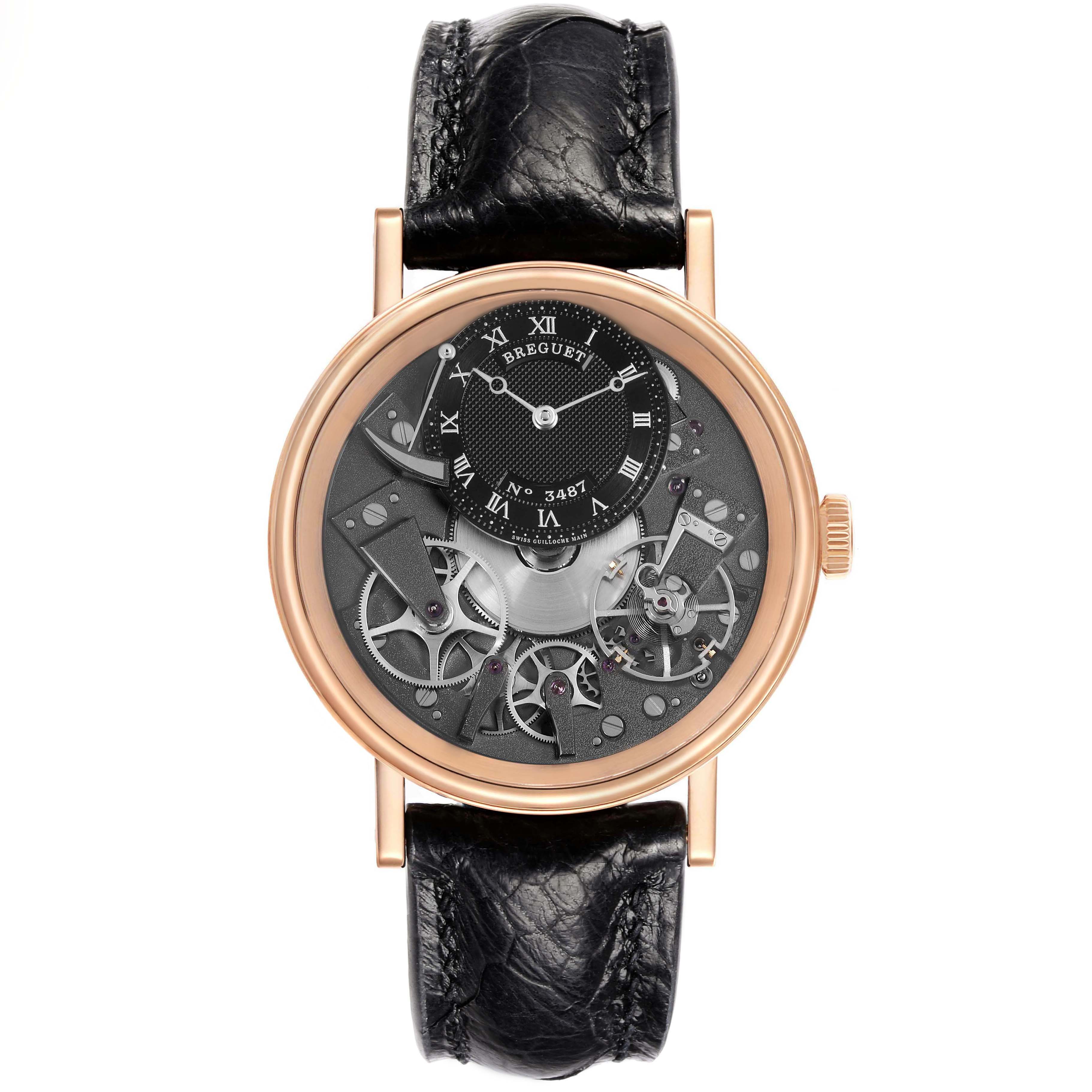 The Breguet Tradition 7057BR/G9/9W6 Men's Rose Gold Silver Dial watch is shown from the front, displaying its intricate open-worked dial and black leather strap.