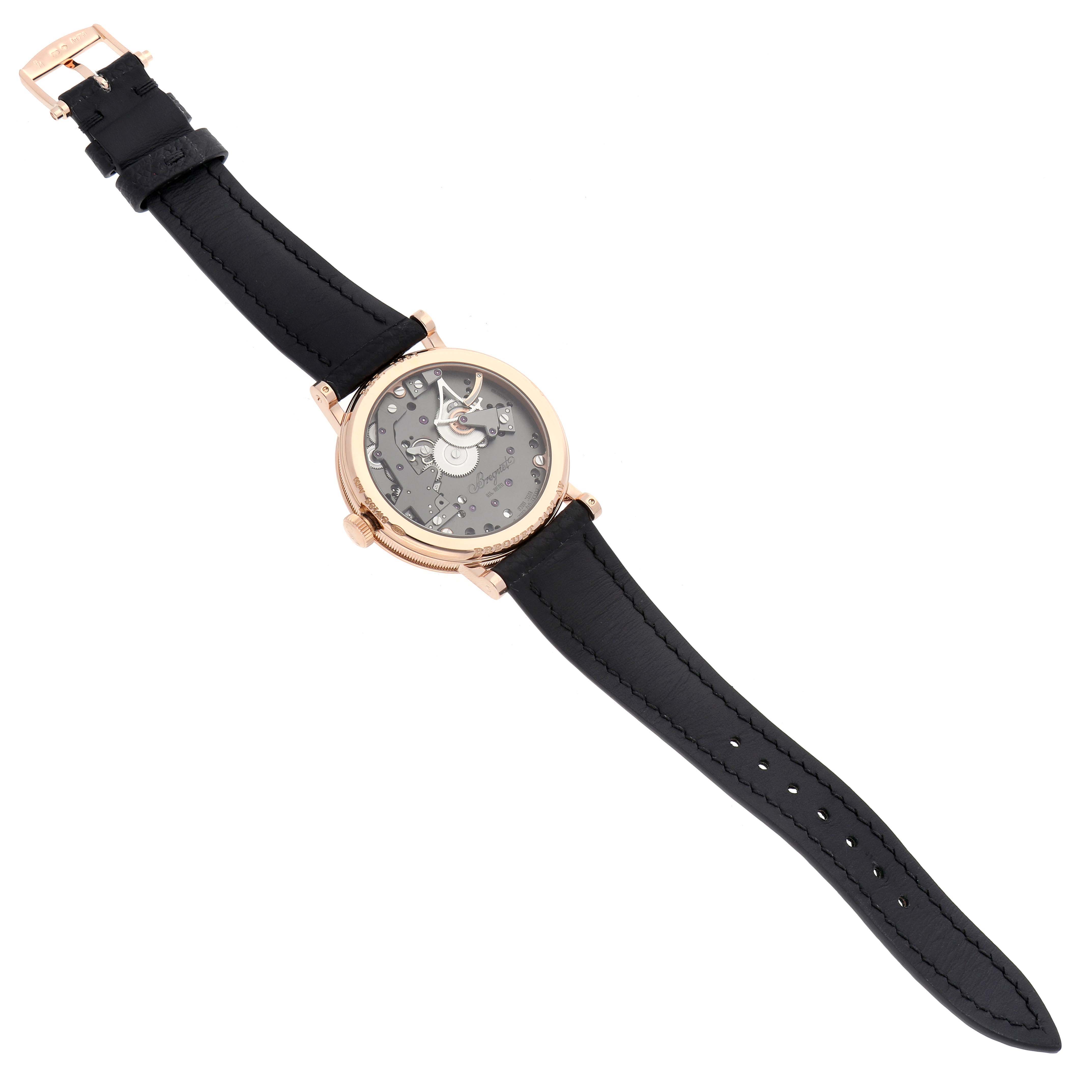 The Breguet Tradition 7057BR/G9/9W6 Men's Rose Gold Silver Dial 7057BR/G9/9W6 Men's Rose Gold Silver Dial watch is shown from a top view, displaying the entire face, case, and black leather strap.