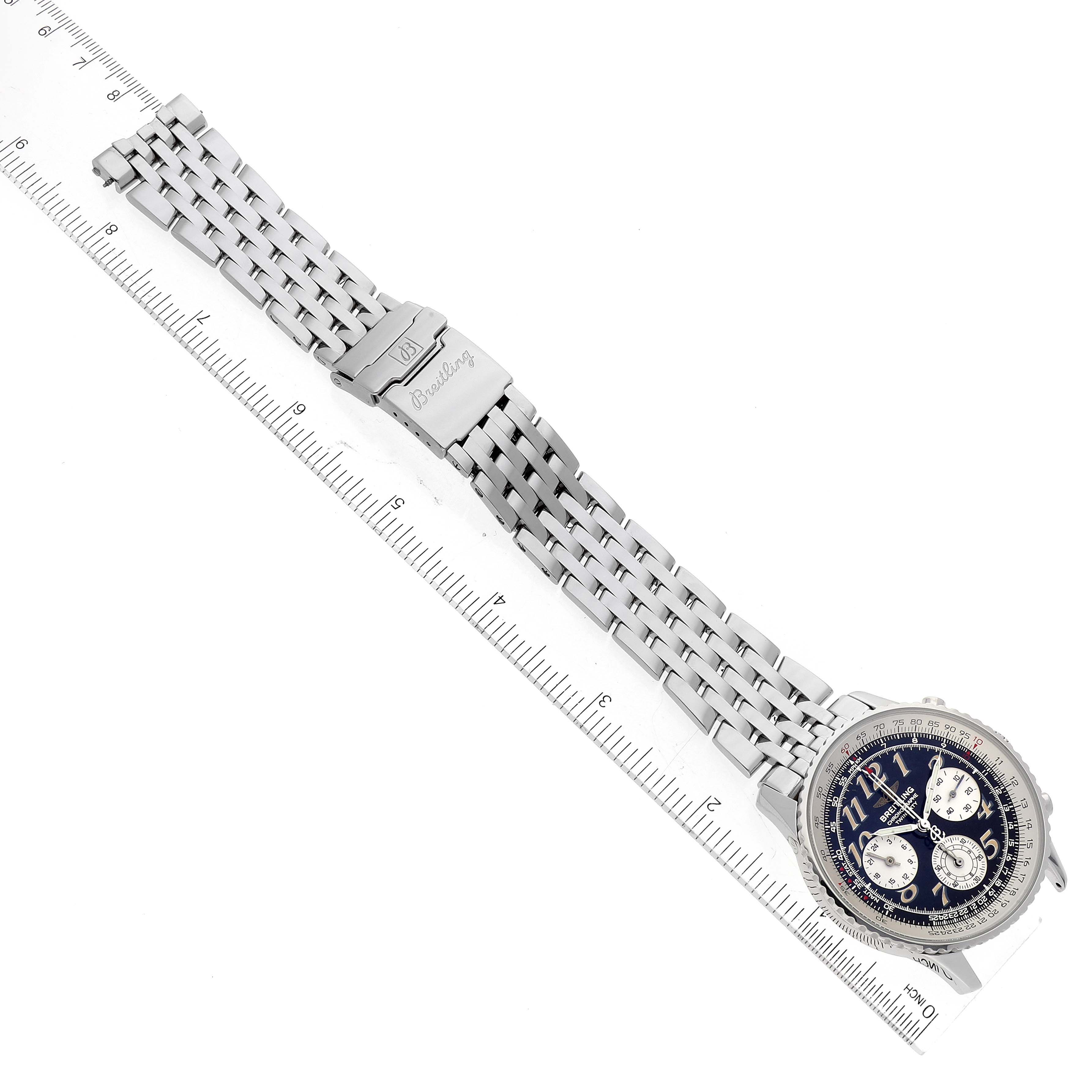 The image shows a top view of a Breitling Navitimer A39022.1 Men's Stainless Steel Black Dial A39022.1 Men's Stainless Steel Black Dial watch, featuring its face, bezel, and bracelet laid beside a ruler.