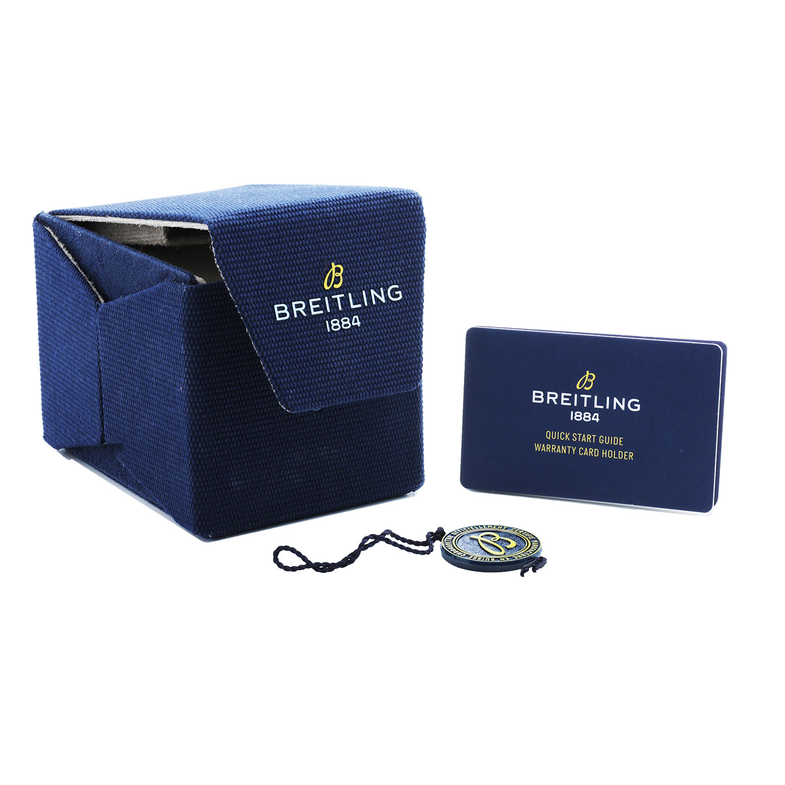 The image shows watch accessories for the Breitling Premier AB0930 Men's Stainless Steel Green Dial model, including a blue box, a card holder, and a tag.
