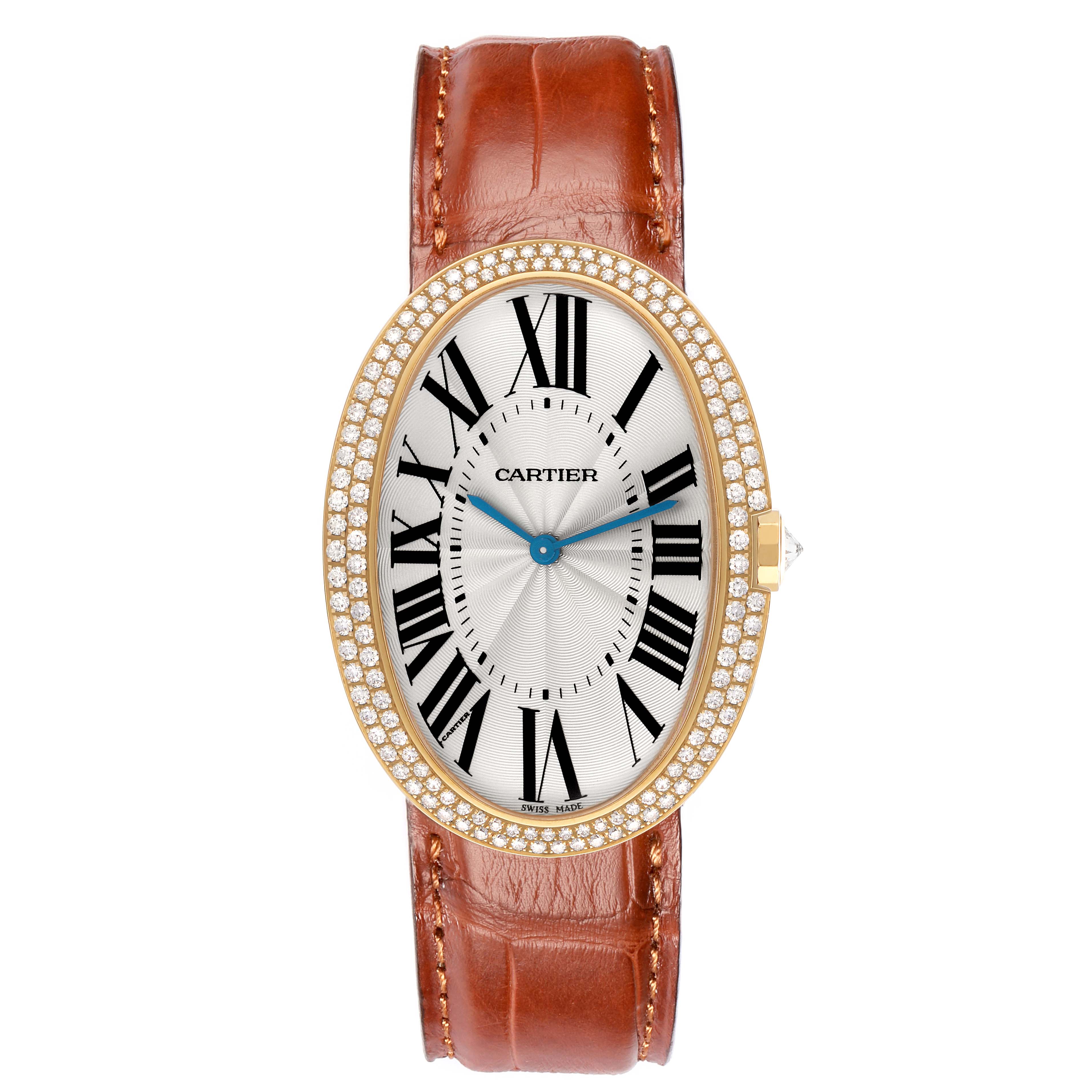 The Cartier Baignoire WB520005 Women
s Yellow Gold Silver Dial watch is shown from the front, displaying its oval face, Roman numerals, and a leather strap.