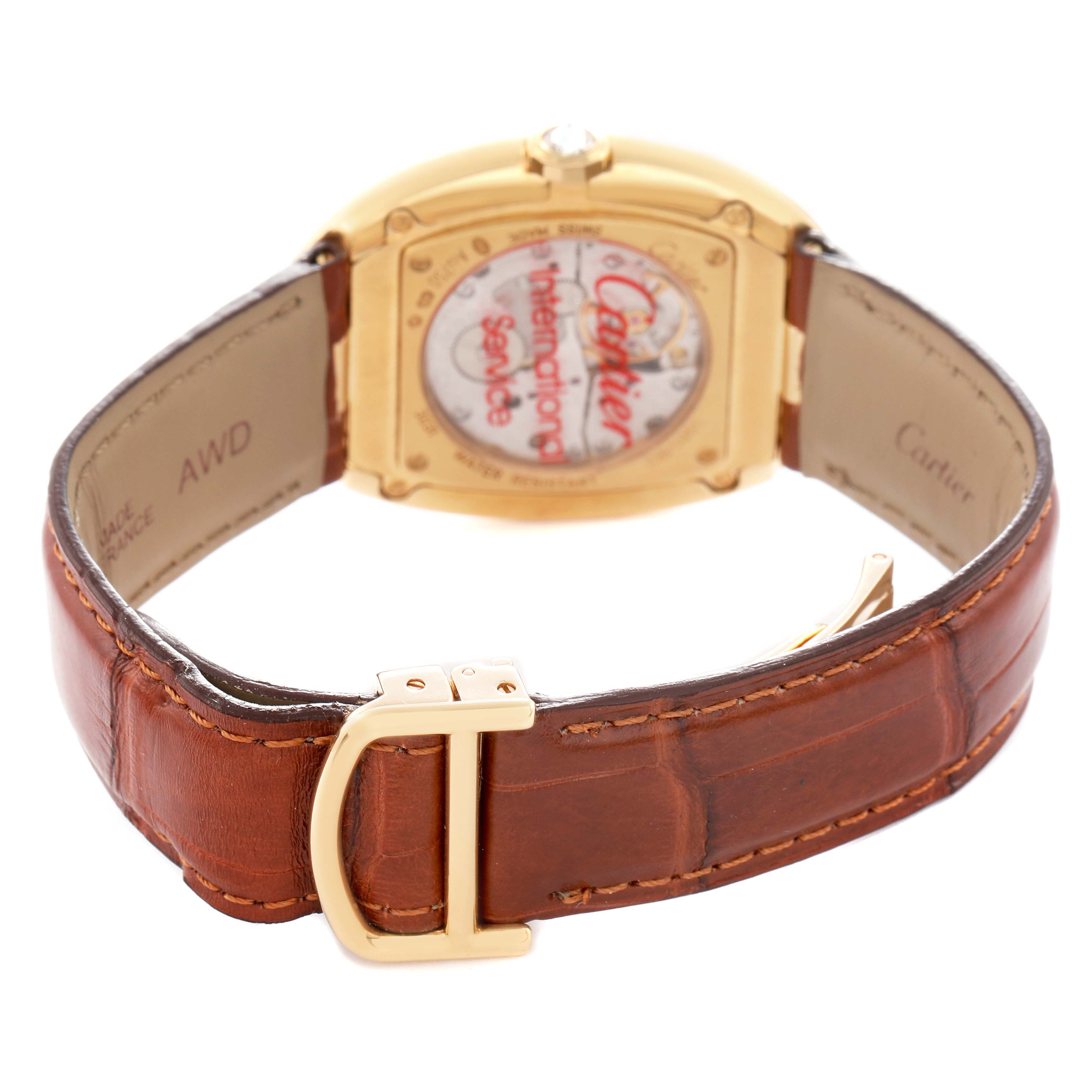 The Cartier Baignoire WB520005 Women
s Yellow Gold Silver Dial is shown from the back, highlighting the gold buckle, brown leather strap, and case back details.