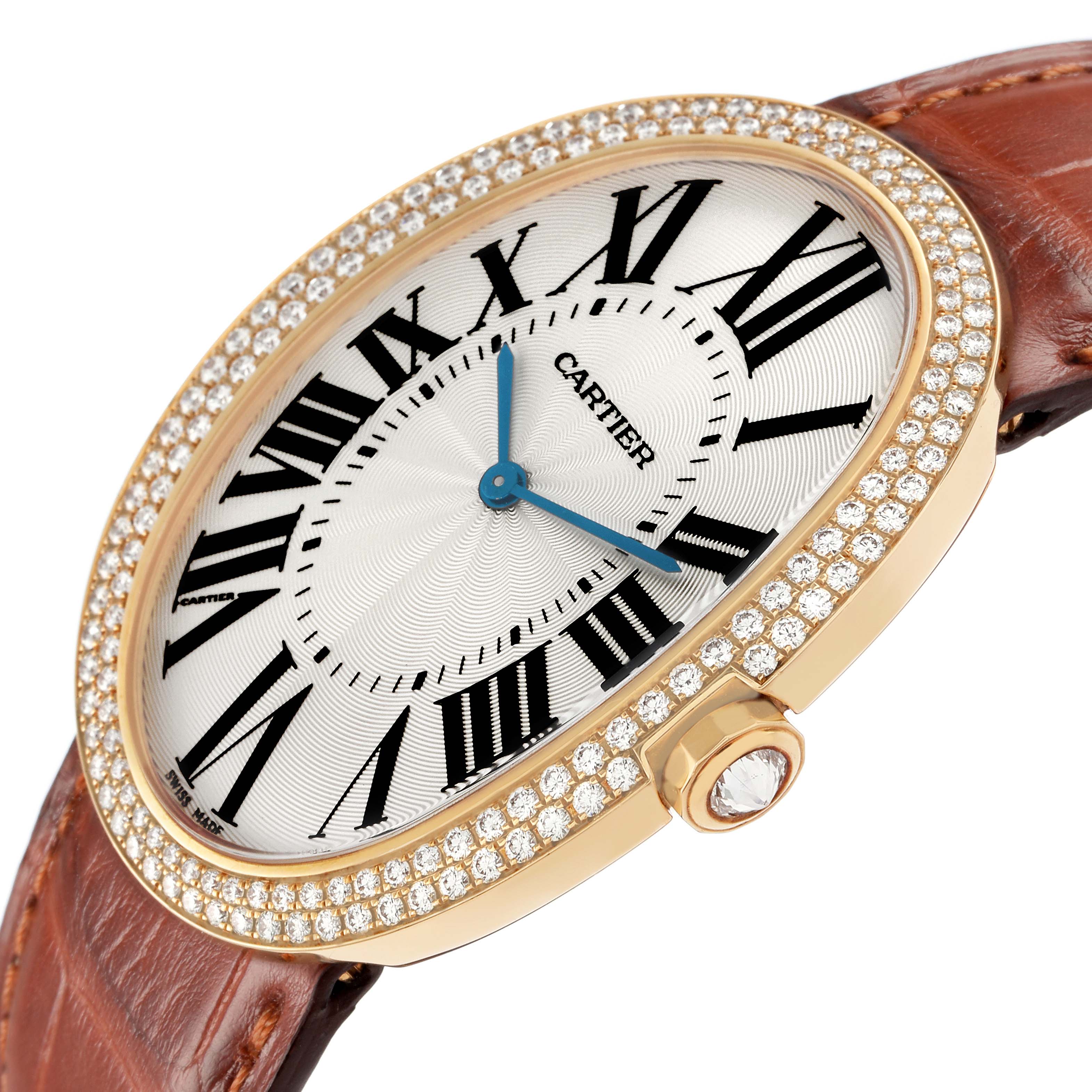 The Cartier Baignoire WB520005 Women
s Yellow Gold Silver Dial watch is shown at a side angle, highlighting its oval dial, diamond bezel, and brown leather strap.