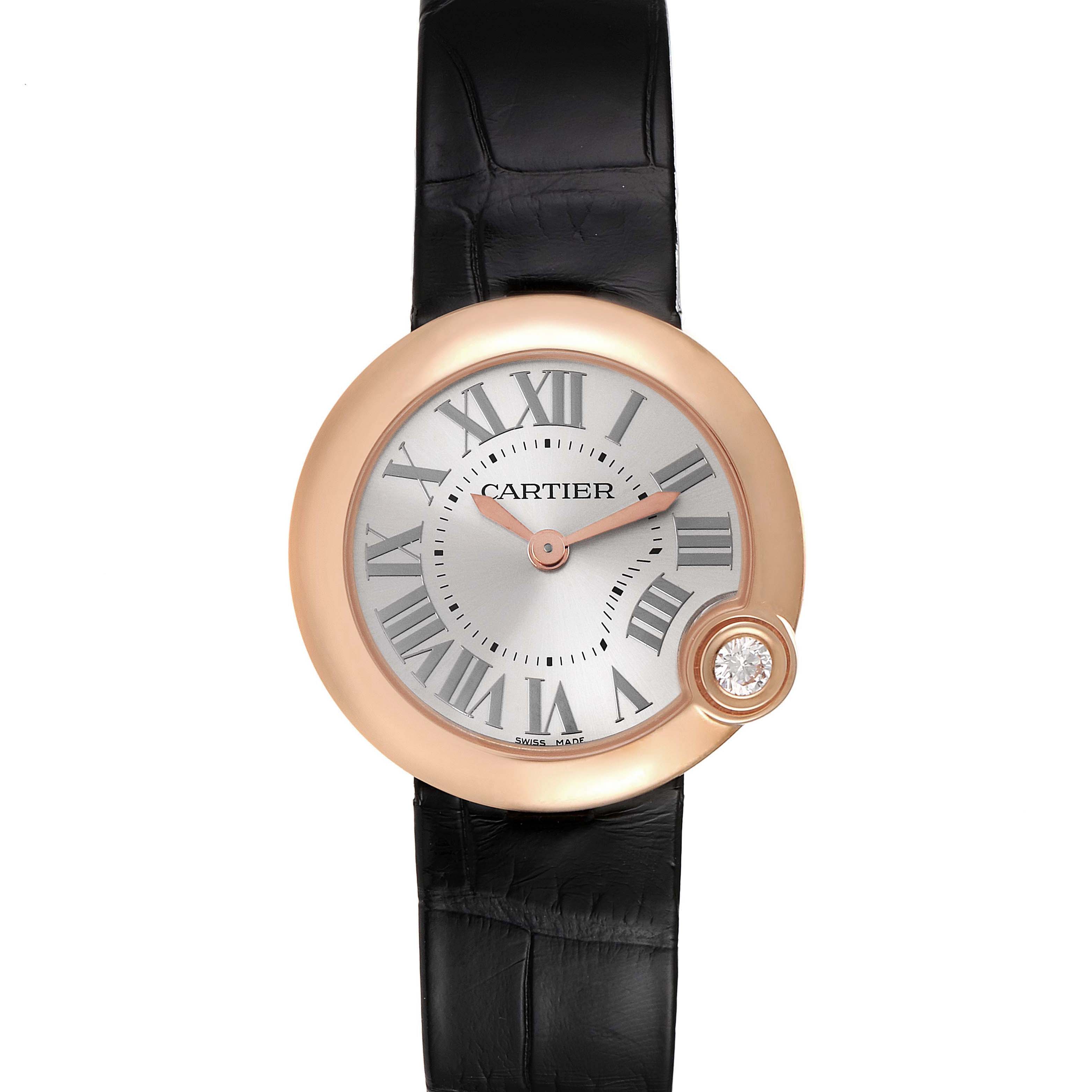 The image shows a front view of the Cartier Ballon Bleu watch, highlighting its face, Roman numerals, and black strap.