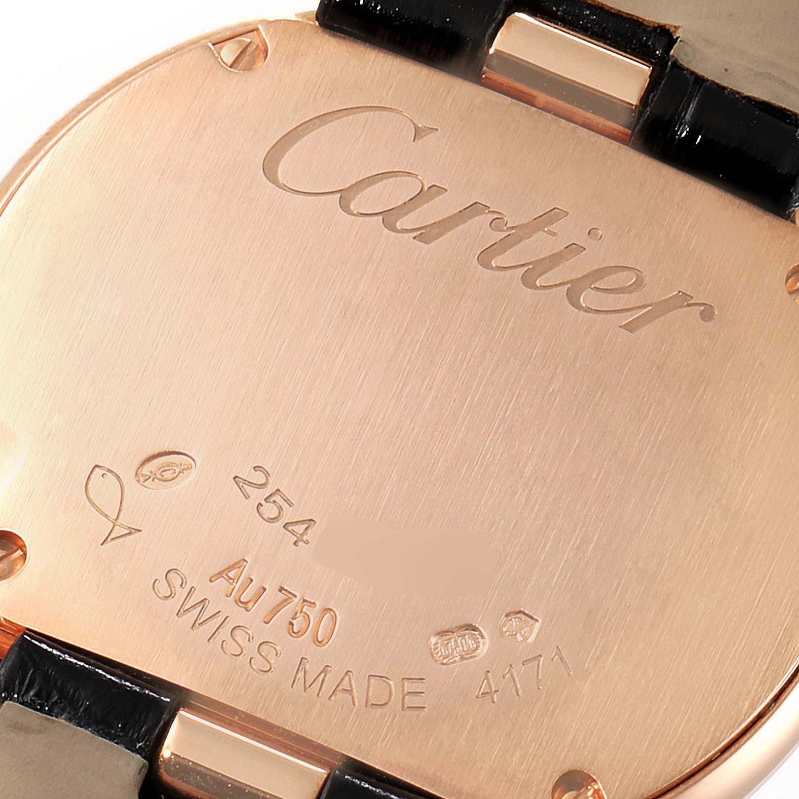 The image shows the back case of a Cartier Ballon Bleu watch, highlighting its inscriptions and leather strap attachments.