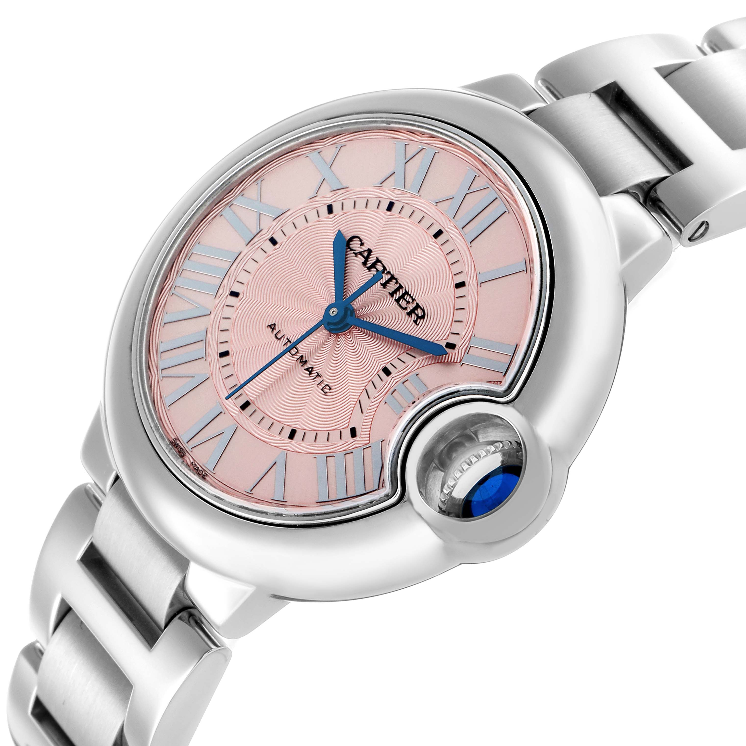 The image shows the Cartier Ballon Bleu WSBB0046 Men
s Stainless Steel Pink Dial watch at an angle highlighting the face, crown, and part of the bracelet.