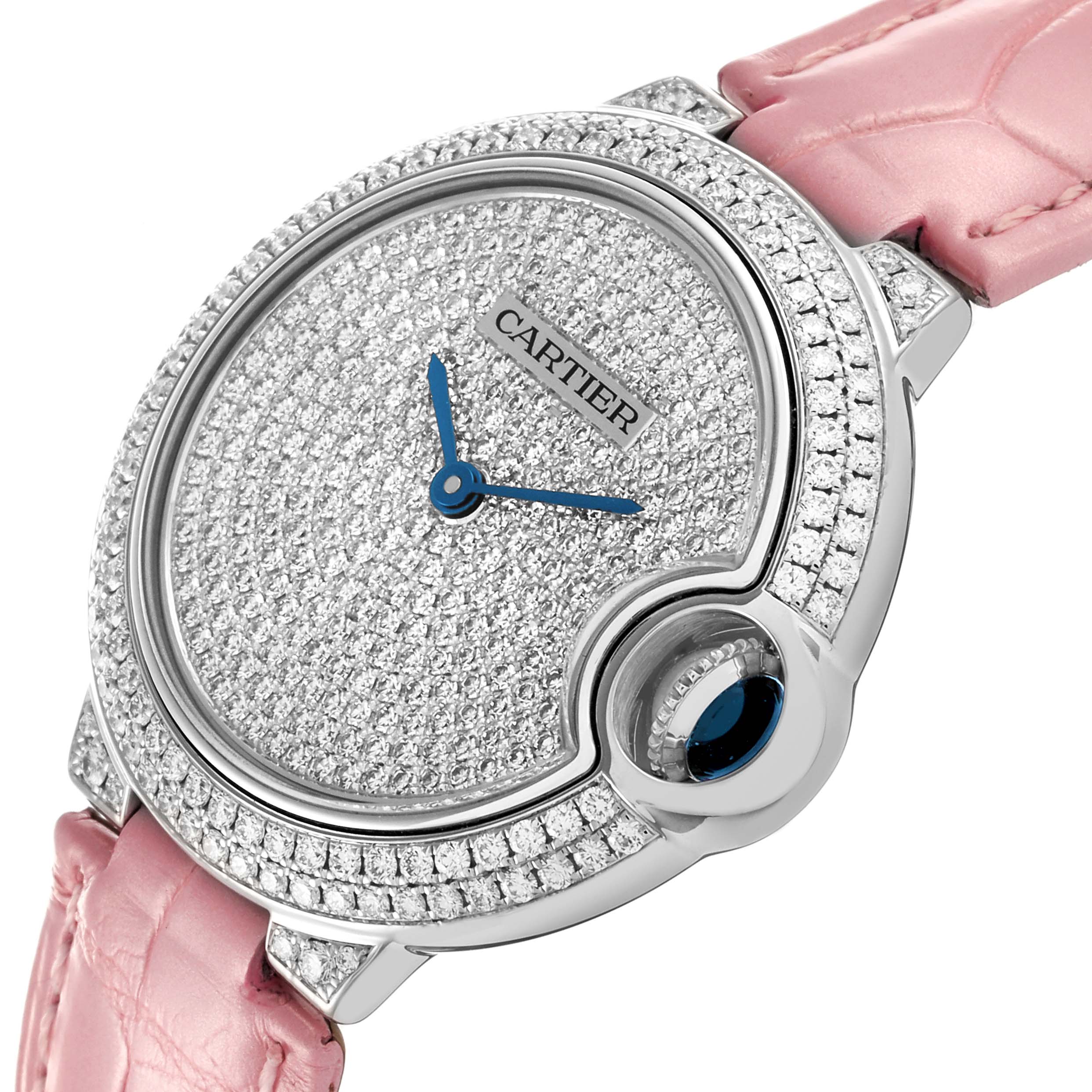 The Ballon Bleu by Cartier is shown at an angled view, highlighting its diamond-studded face and bezel with a pink strap.