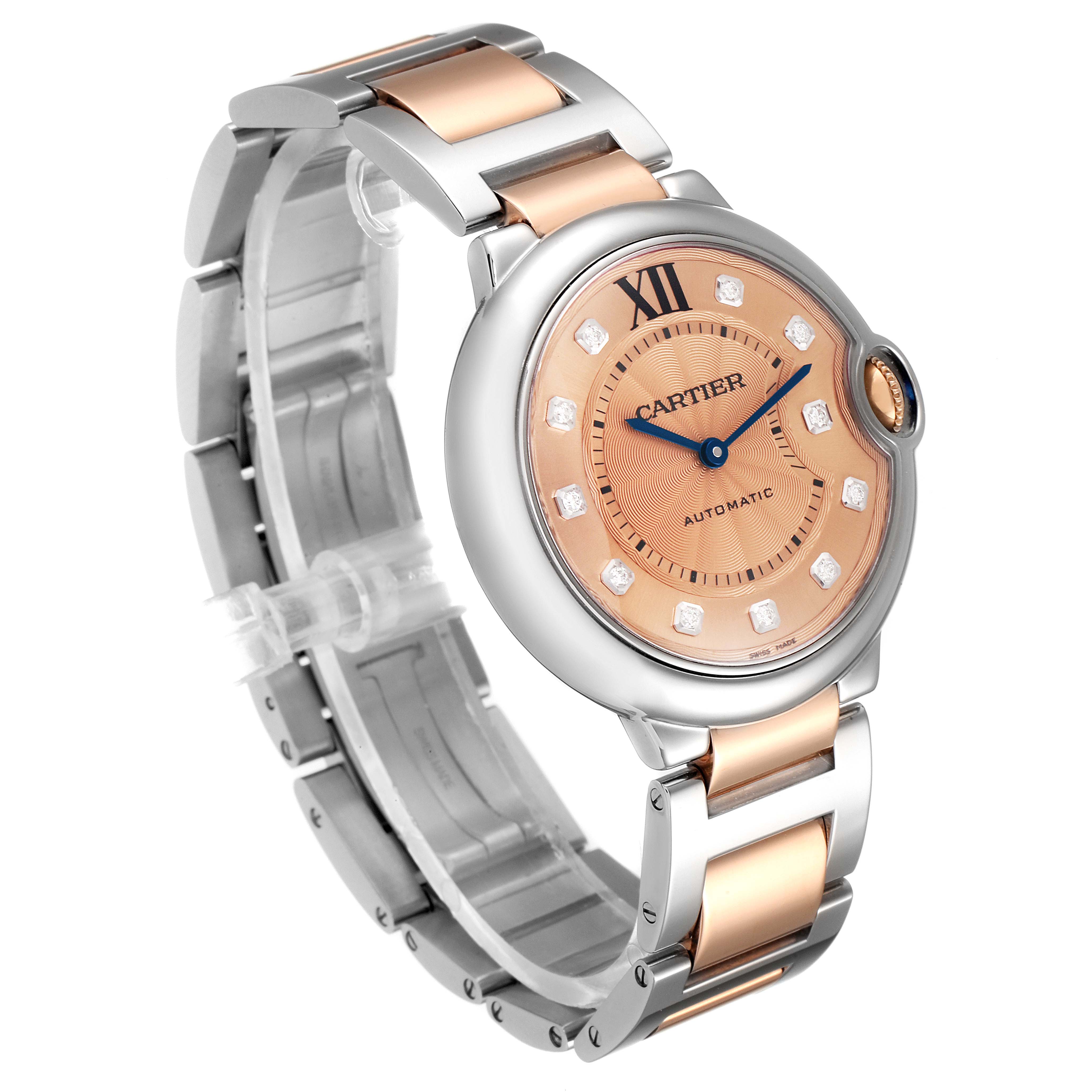 The image shows an angled view of the Cartier Ballon Bleu WE902054 Women's Steel and Gold (two tone) Pink Dial WE902054 Women's Steel and Gold (two tone) Pink Dial watch, highlighting the dial, bezel, and two-tone metal bracelet.