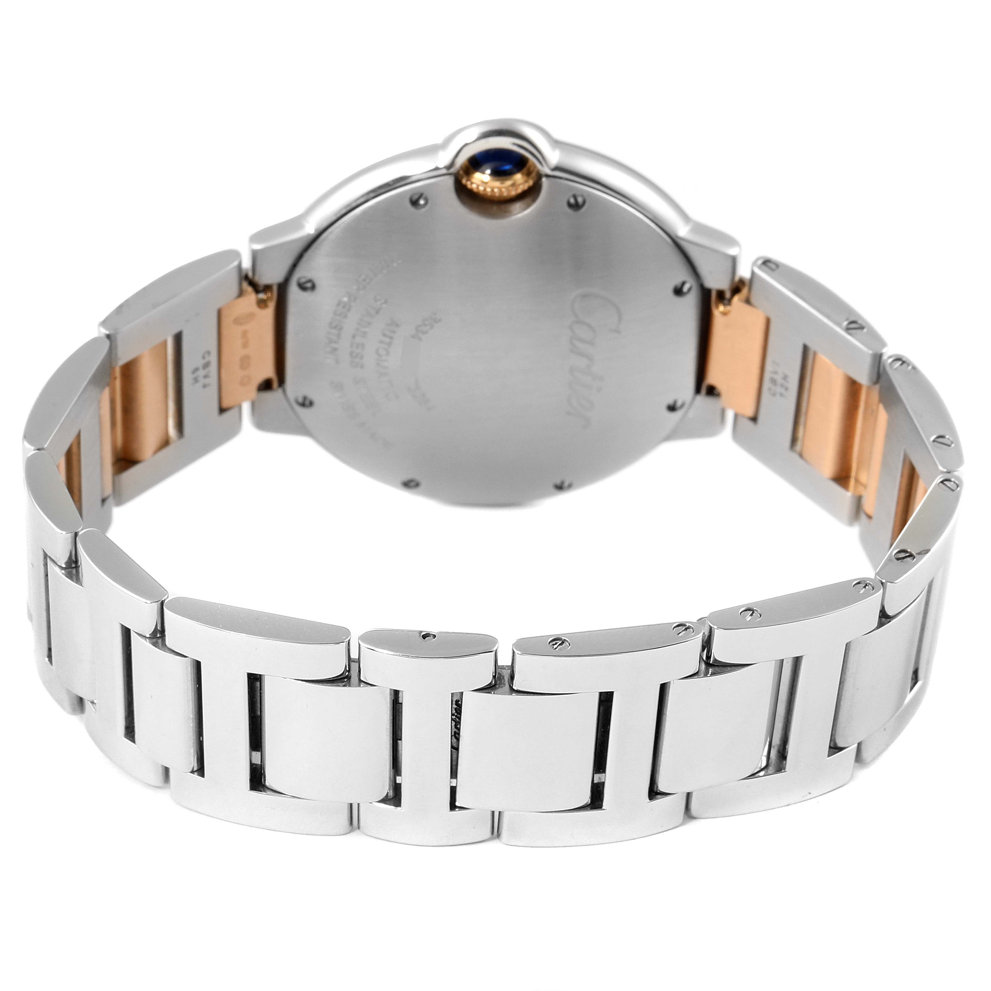 This image shows the back of a Cartier Ballon Bleu WE902054 Women's Steel and Gold (two tone) Pink Dial WE902054 Women's Steel and Gold (two tone) Pink Dial watch, highlighting its wristband and caseback.