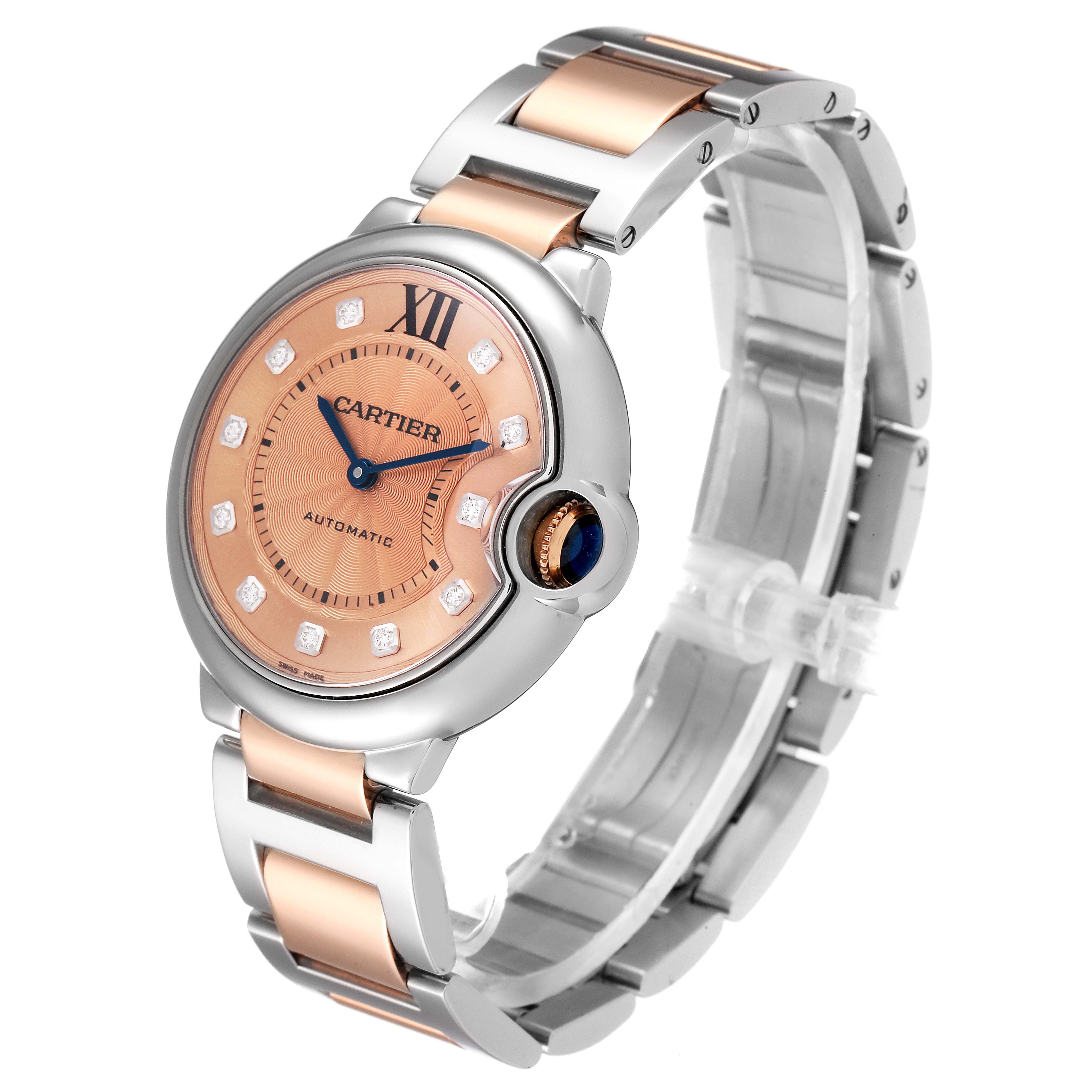 The Cartier Ballon Bleu WE902054 Women's Steel and Gold (two tone) Pink Dial WE902054 Women's Steel and Gold (two tone) Pink Dial watch is shown at a front angle, displaying its face, bracelet, and crown.