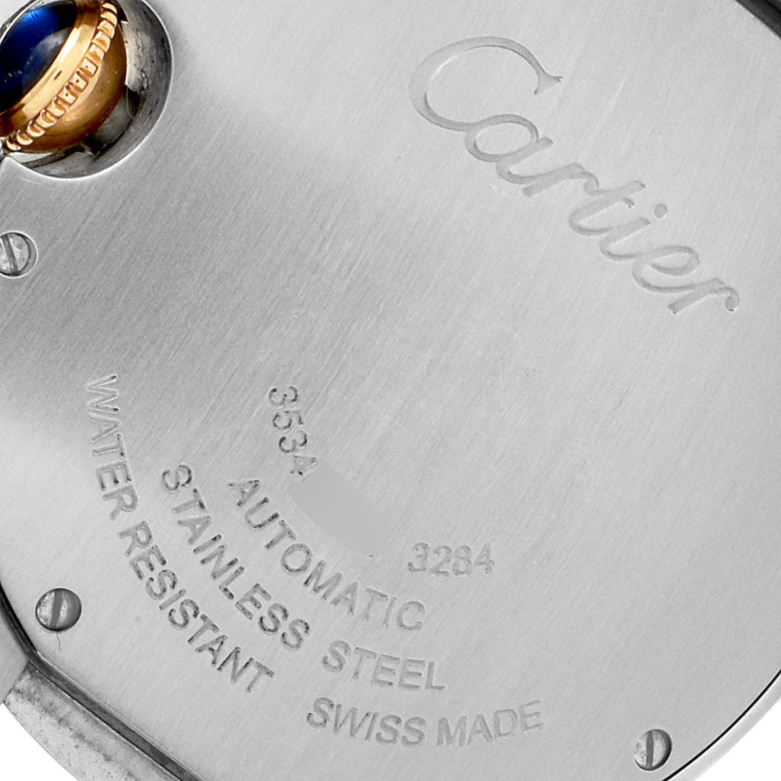 This image shows the engraved back casing and crown of the Cartier Ballon Bleu WE902054 Women's Steel and Gold (two tone) Pink Dial WE902054 Women's Steel and Gold (two tone) Pink Dial watch.