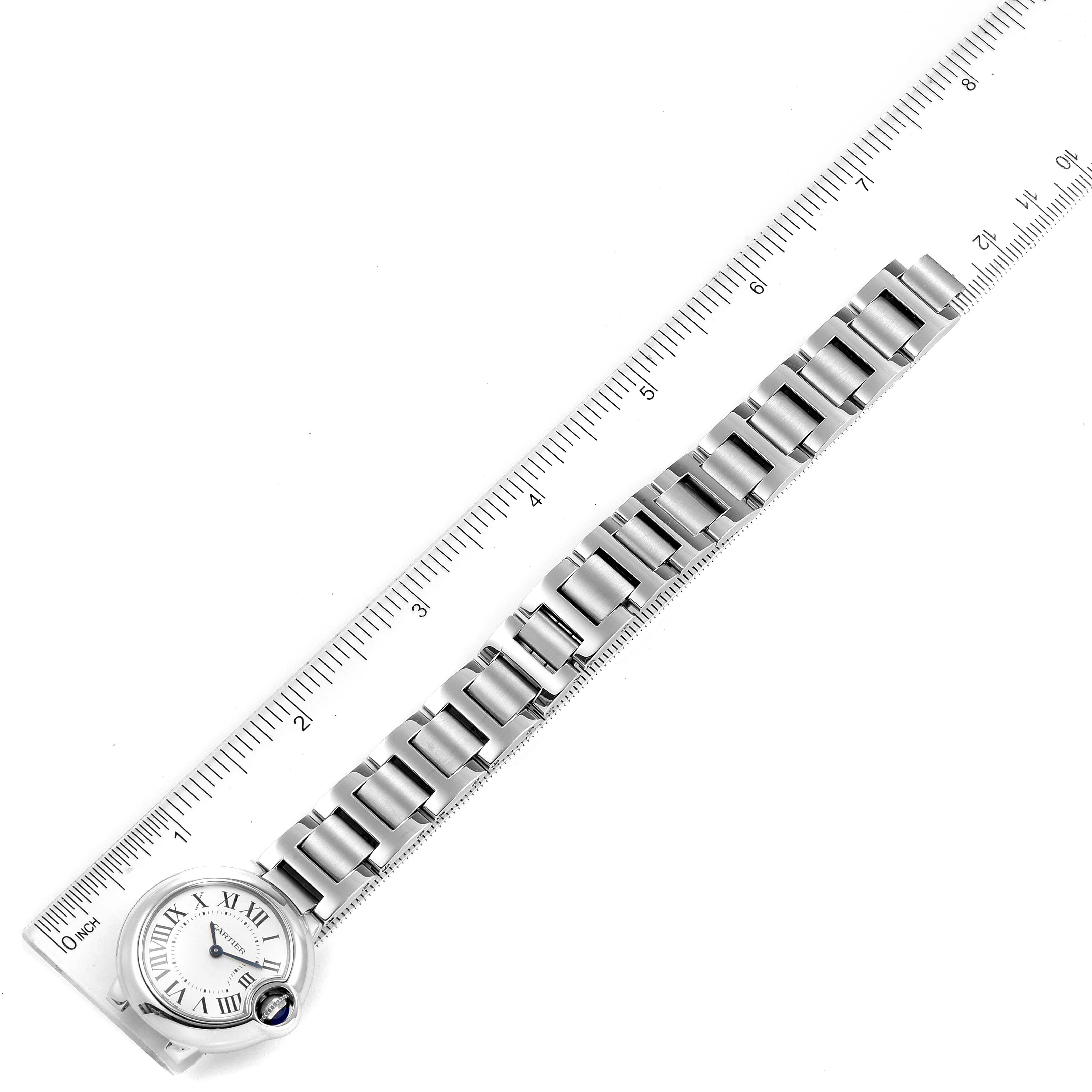The image shows a top-down view of the Cartier Ballon Bleu W69010Z4 Women
s Stainless Steel Silver Dial W69010Z4 Women
s Stainless Steel Silver Dial watch, including its face, band, and a ruler for scale.