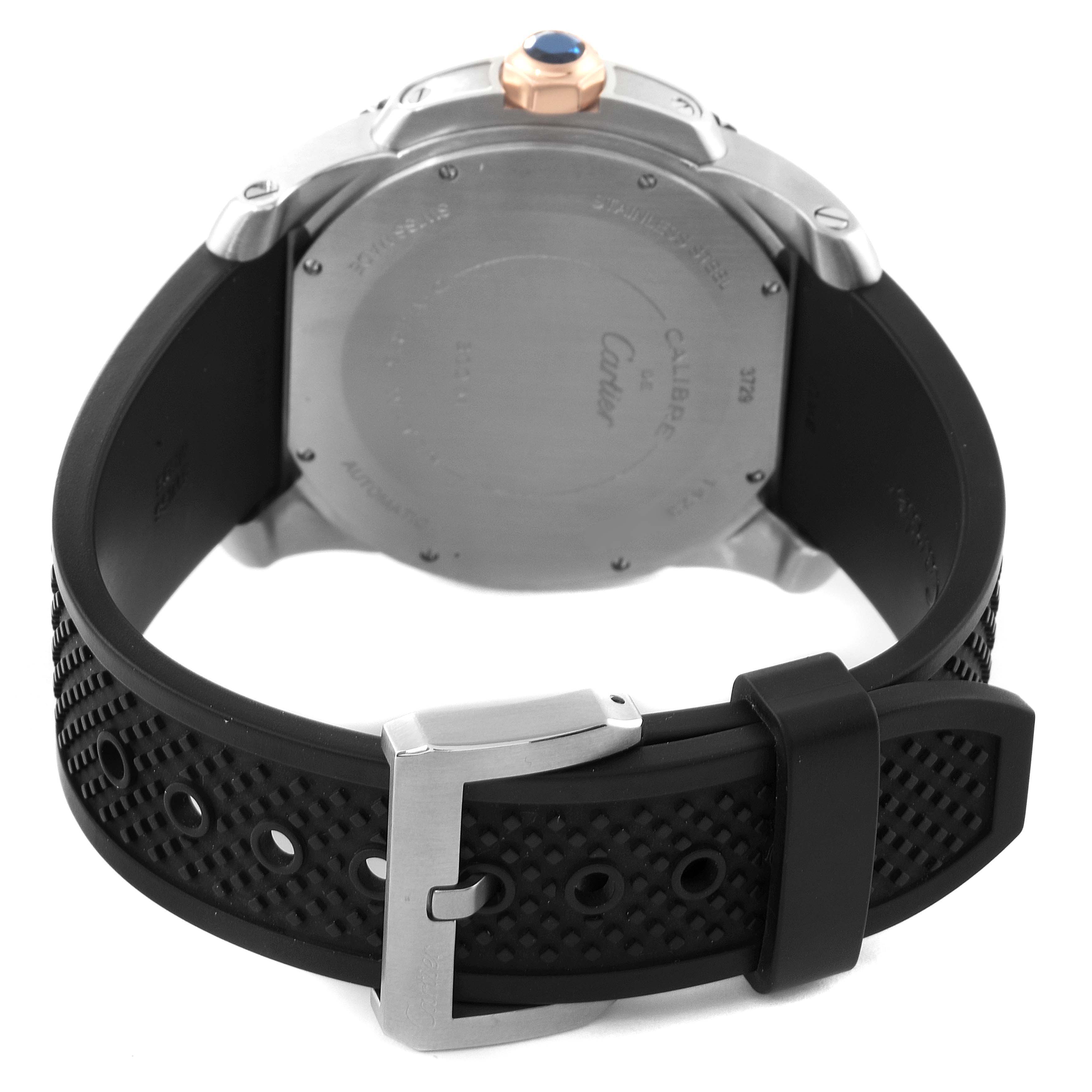 The image shows the back of a Calibre de Cartier watch by Cartier, highlighting the case back, strap, and buckle.