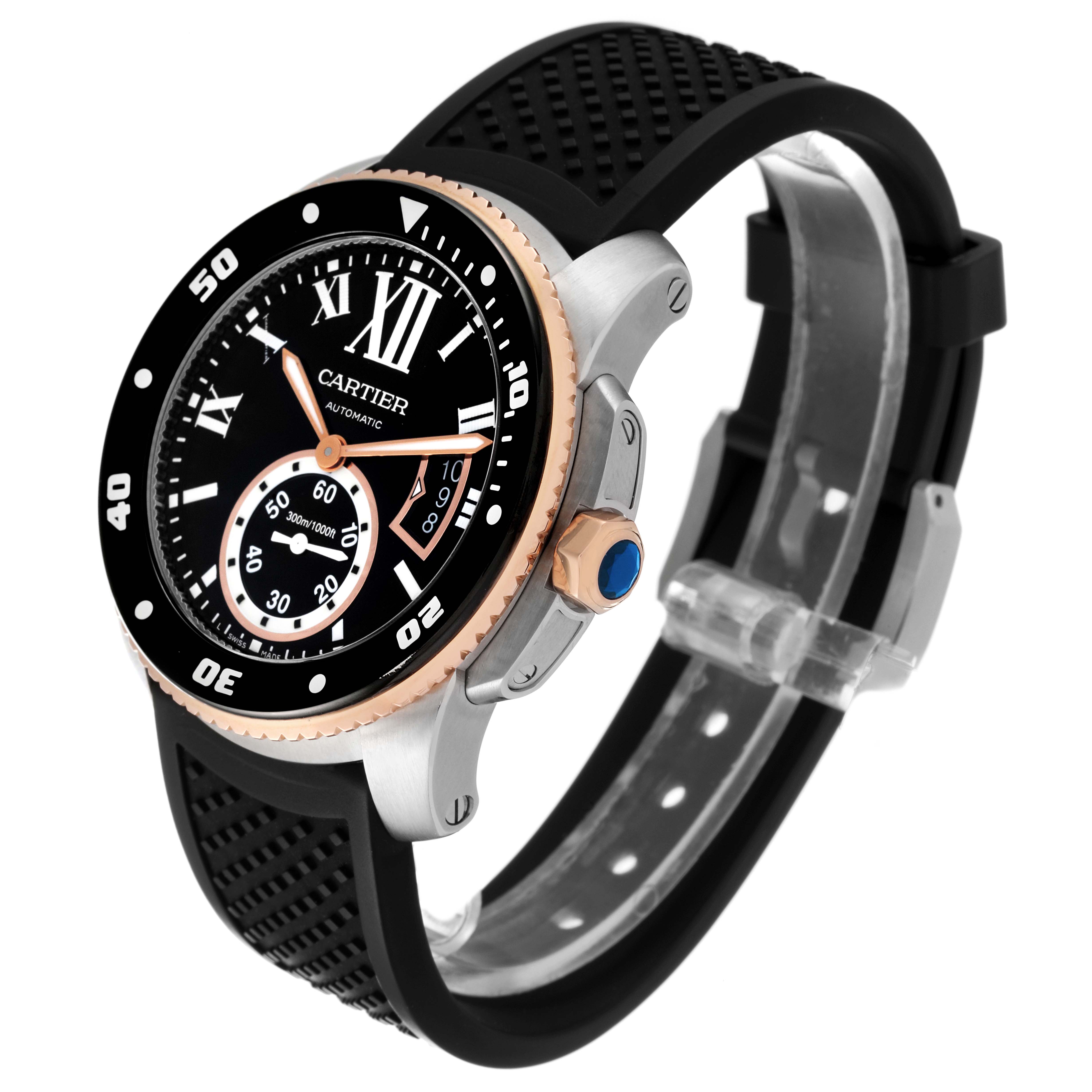 The Calibre de Cartier watch by Cartier is shown at a three-quarter front angle, displaying the dial, bezel, crown, and strap.