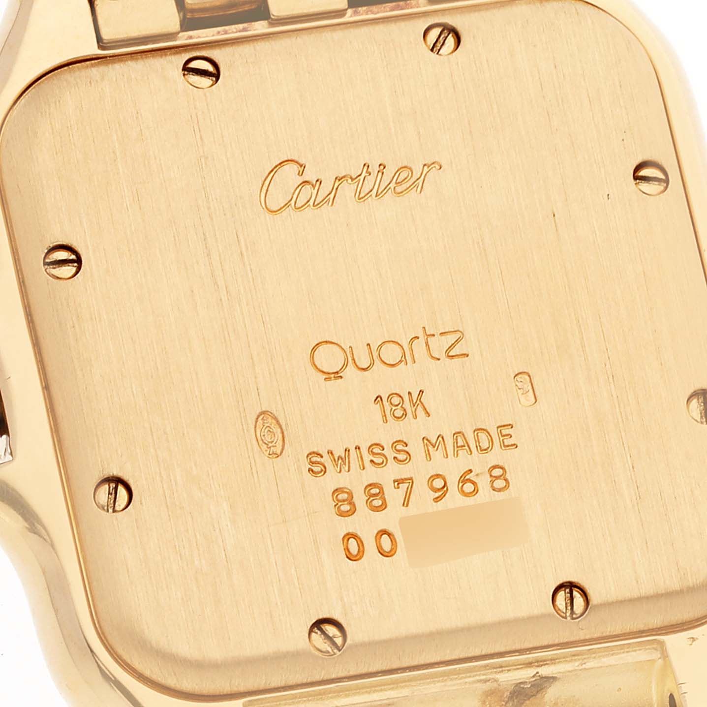 The image shows the back case of a Cartier Panthere W25014B9 Men's Yellow Gold Silver Dial W25014B9 Men's Yellow Gold Silver Dial watch, highlighting inscriptions and screws.