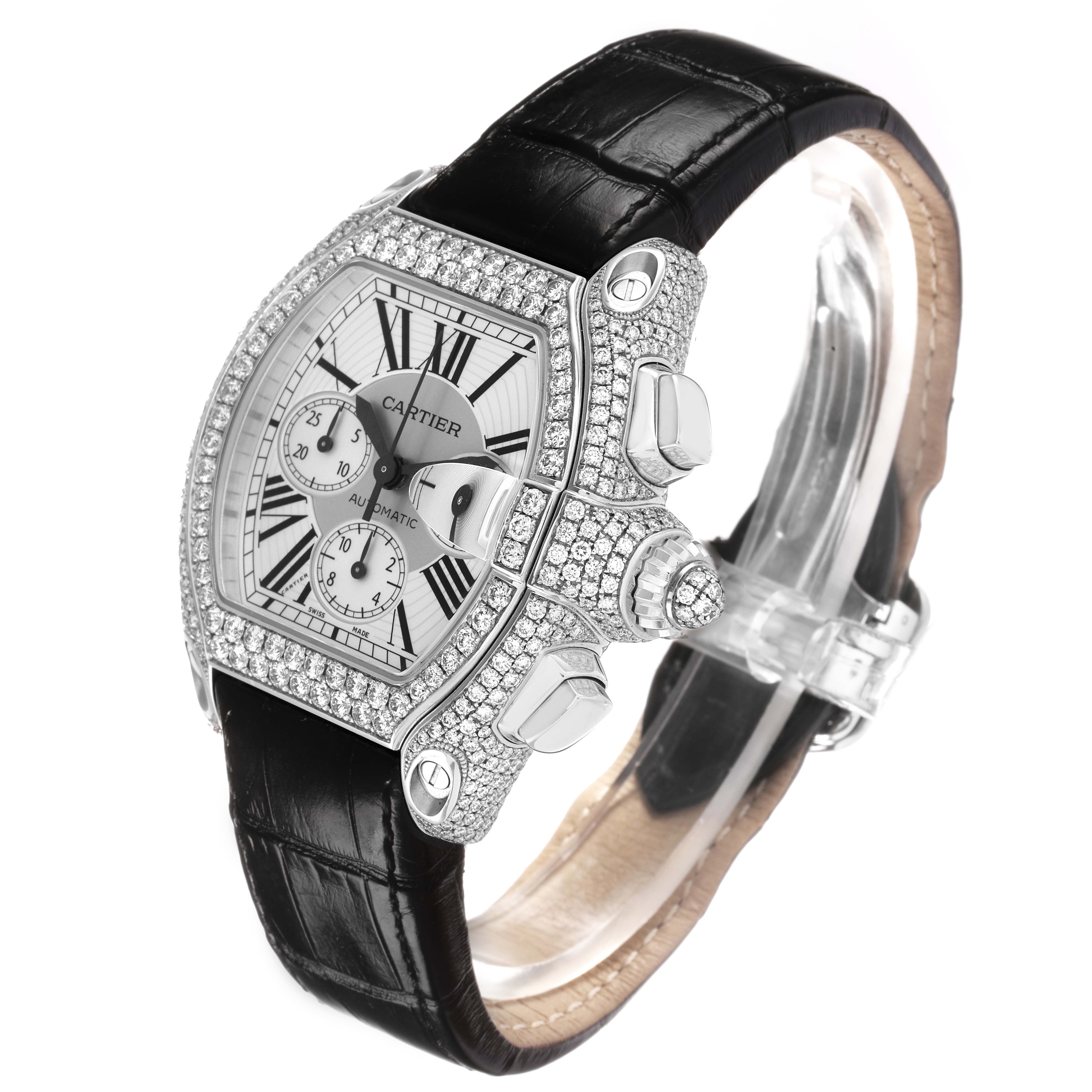 The Cartier Roadster WE50032H Men
s White Gold Silver Dial watch is shown at a three-quarter angle, highlighting its dial, bezel, crown, and leather strap.