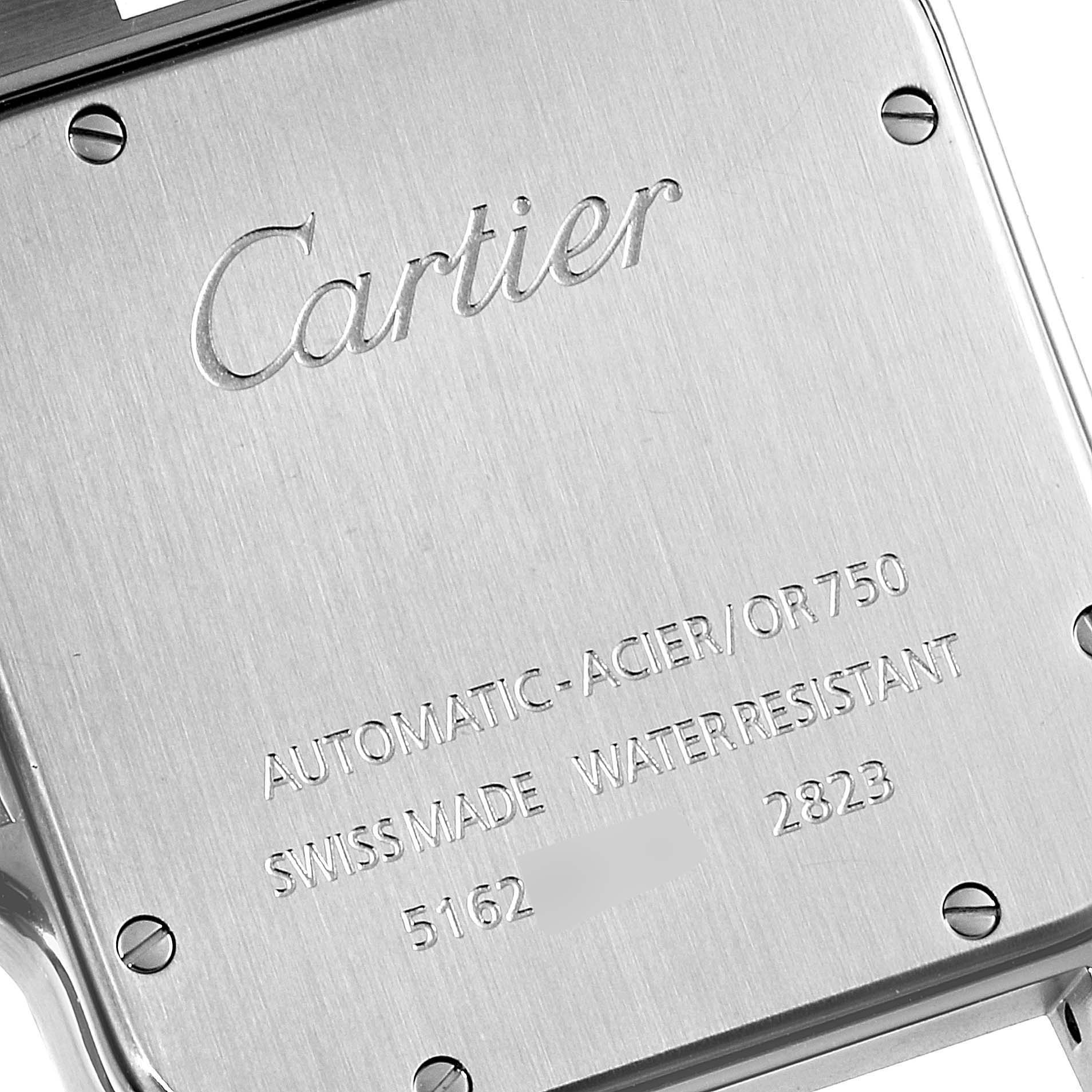 The image shows the back case of a Cartier Santos W20099C4 Men
s Steel and Gold (two tone) Silver Dial W20099C4 Men
s Steel and Gold (two tone) Silver Dial watch, displaying engraved text and screws.