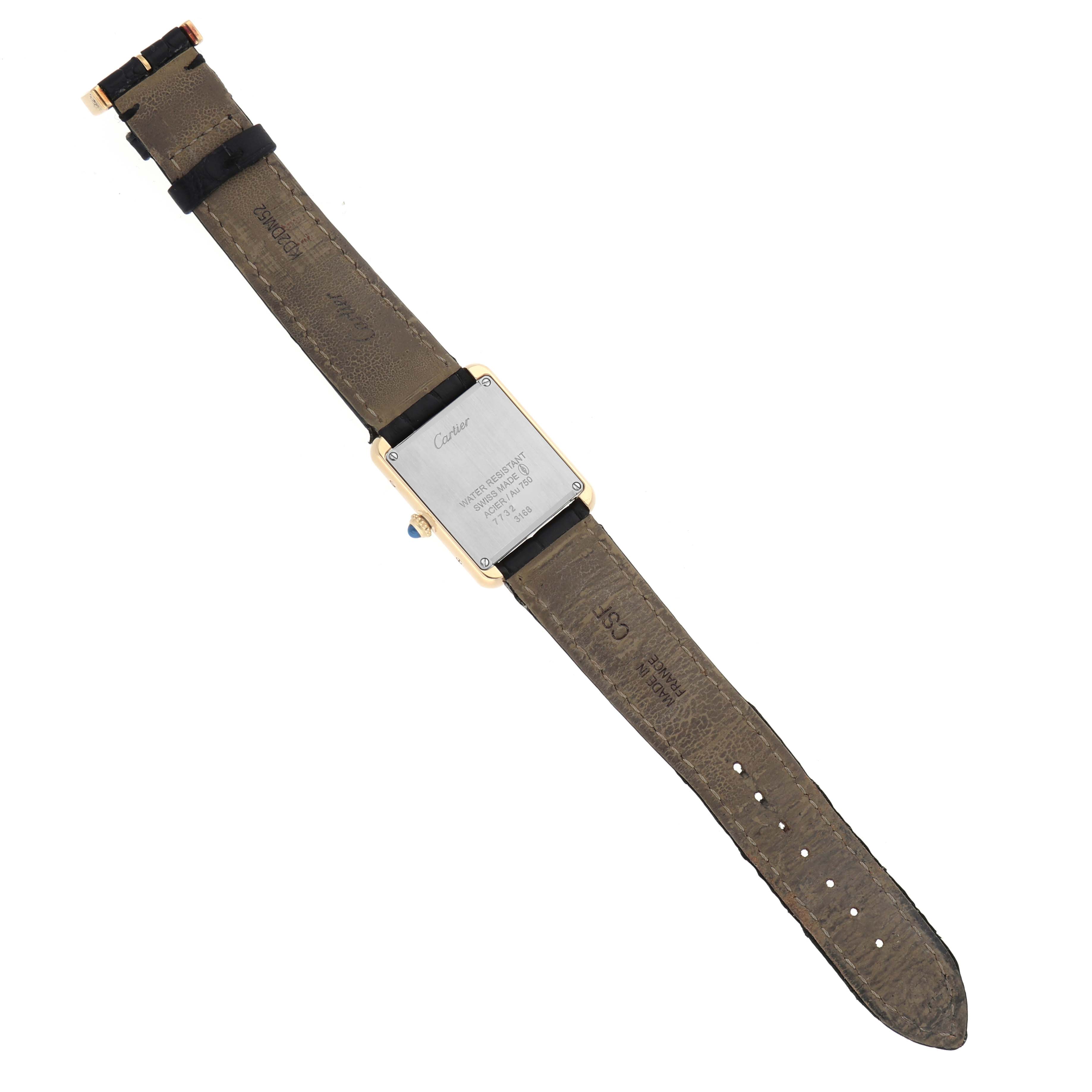 The Cartier Tank Solo W5200002 Men's Steel and Gold (two tone) White Dial watch is shown from the back, displaying the case back, leather strap, and buckle.