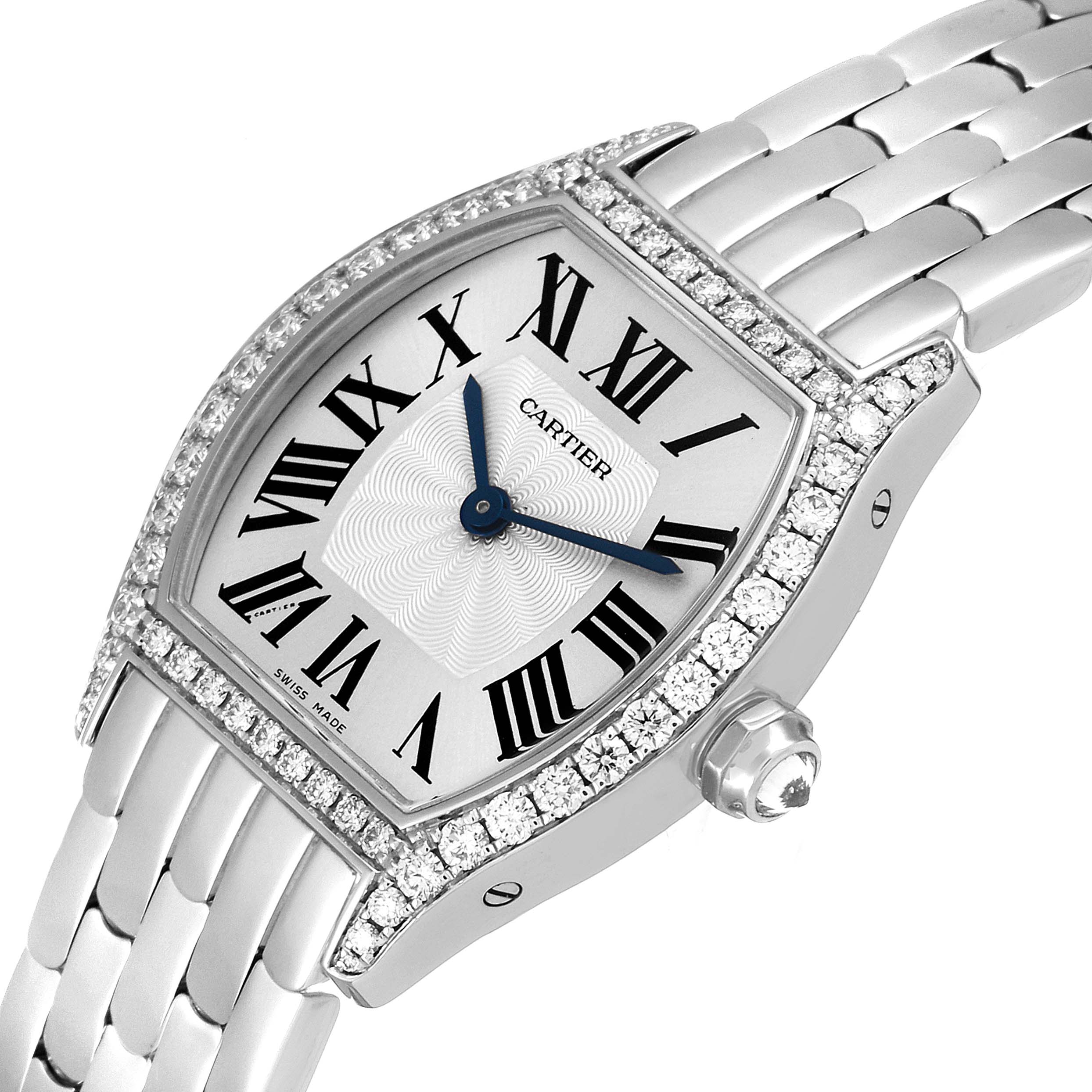 The image shows a Cartier Tortue WA501011 Women's White Gold Silver Dial WA501011 Women's White Gold Silver Dial watch from a slightly tilted angle, highlighting its face, diamond-studded bezel, and bracelet.