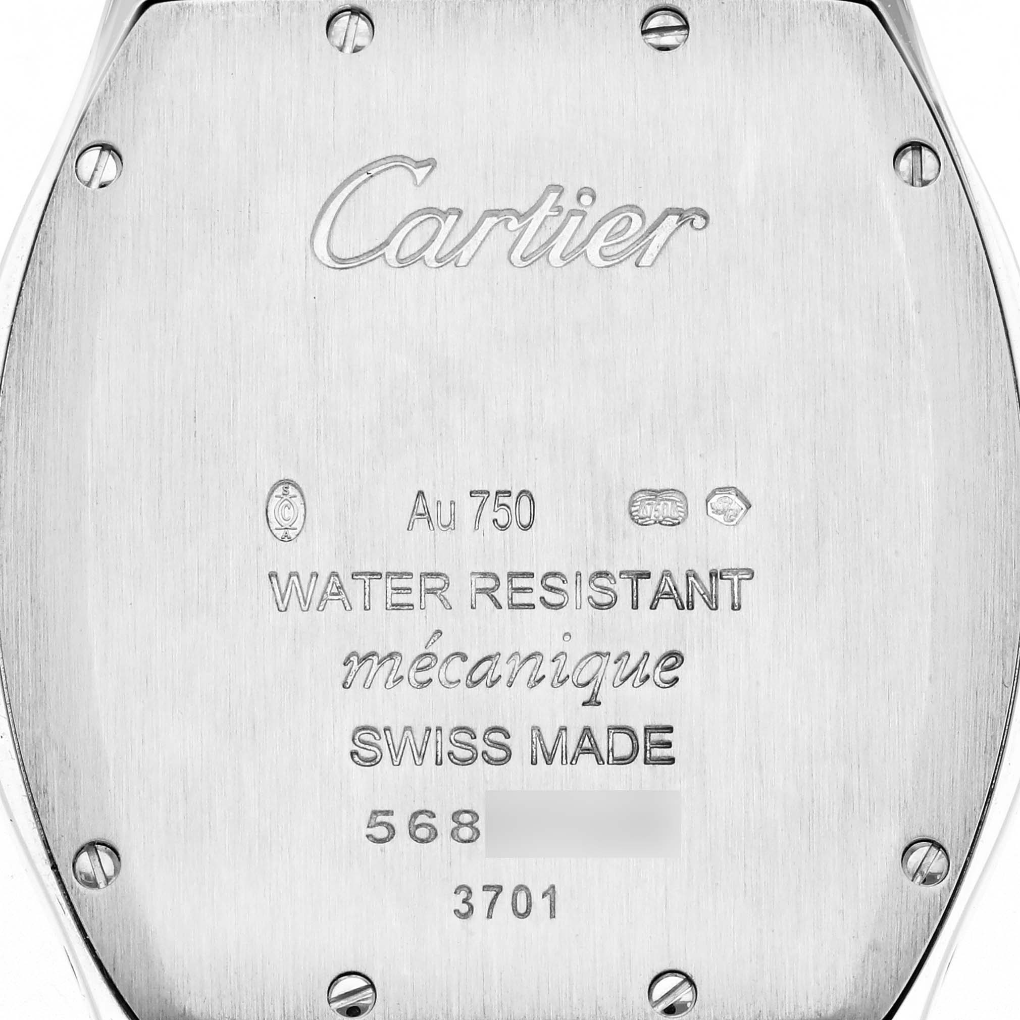 The image shows the back of a Cartier Tortue men's watch, model WA501009, displaying engravings and screws on the case back.