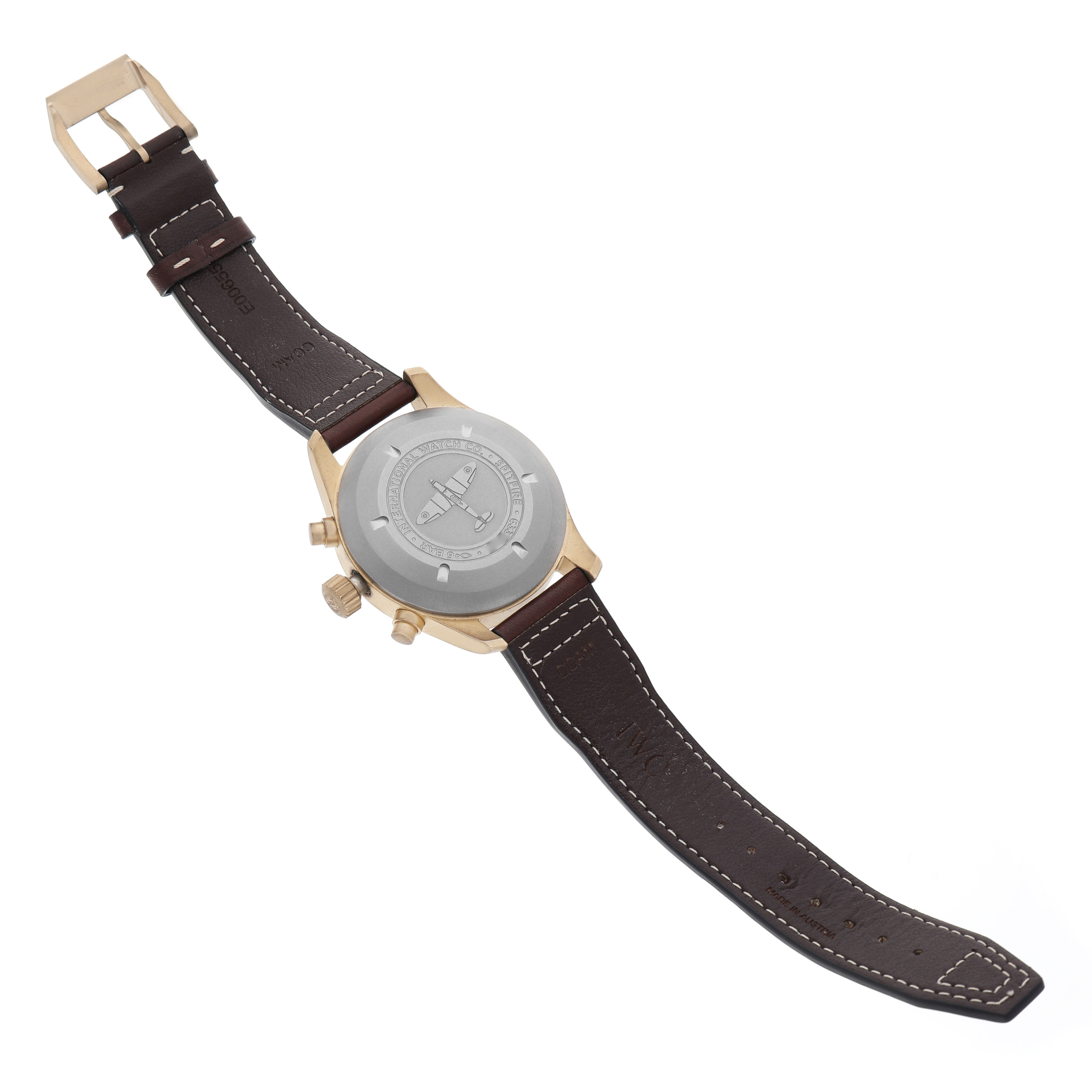 The image shows the back view of an IWC Pilot IW387902 Men's Bronze Green Dial watch, highlighting its case back, leather strap, and clasp.