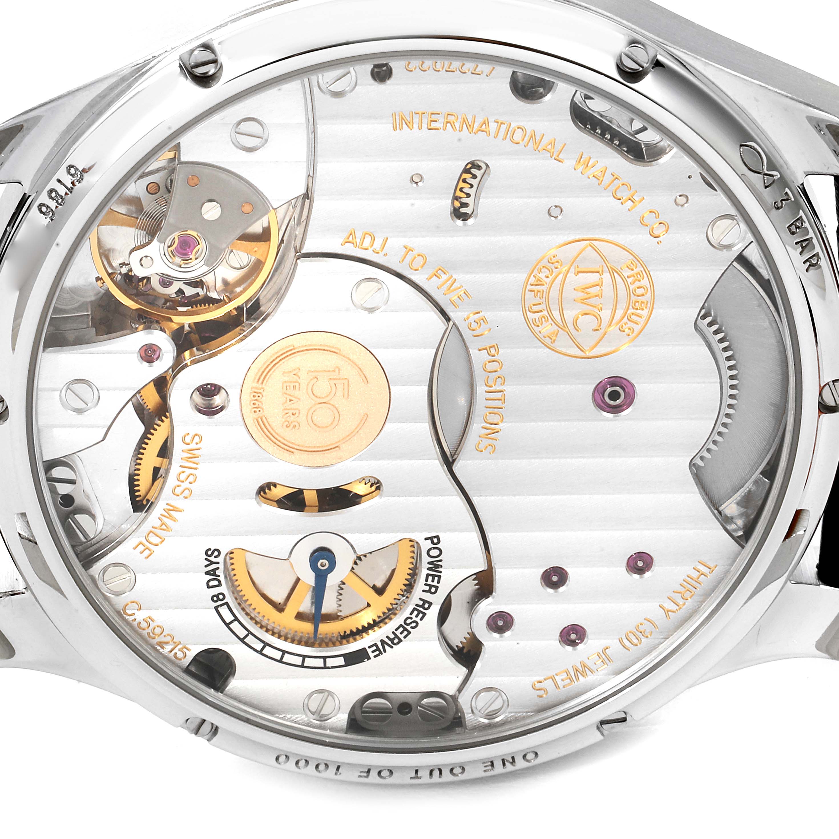 The image shows the backside of the IWC Portuguese IW510212 Men's Stainless Steel White Dial IW510212 Men's Stainless Steel White Dial model watch, displaying its internal mechanics and engravings.