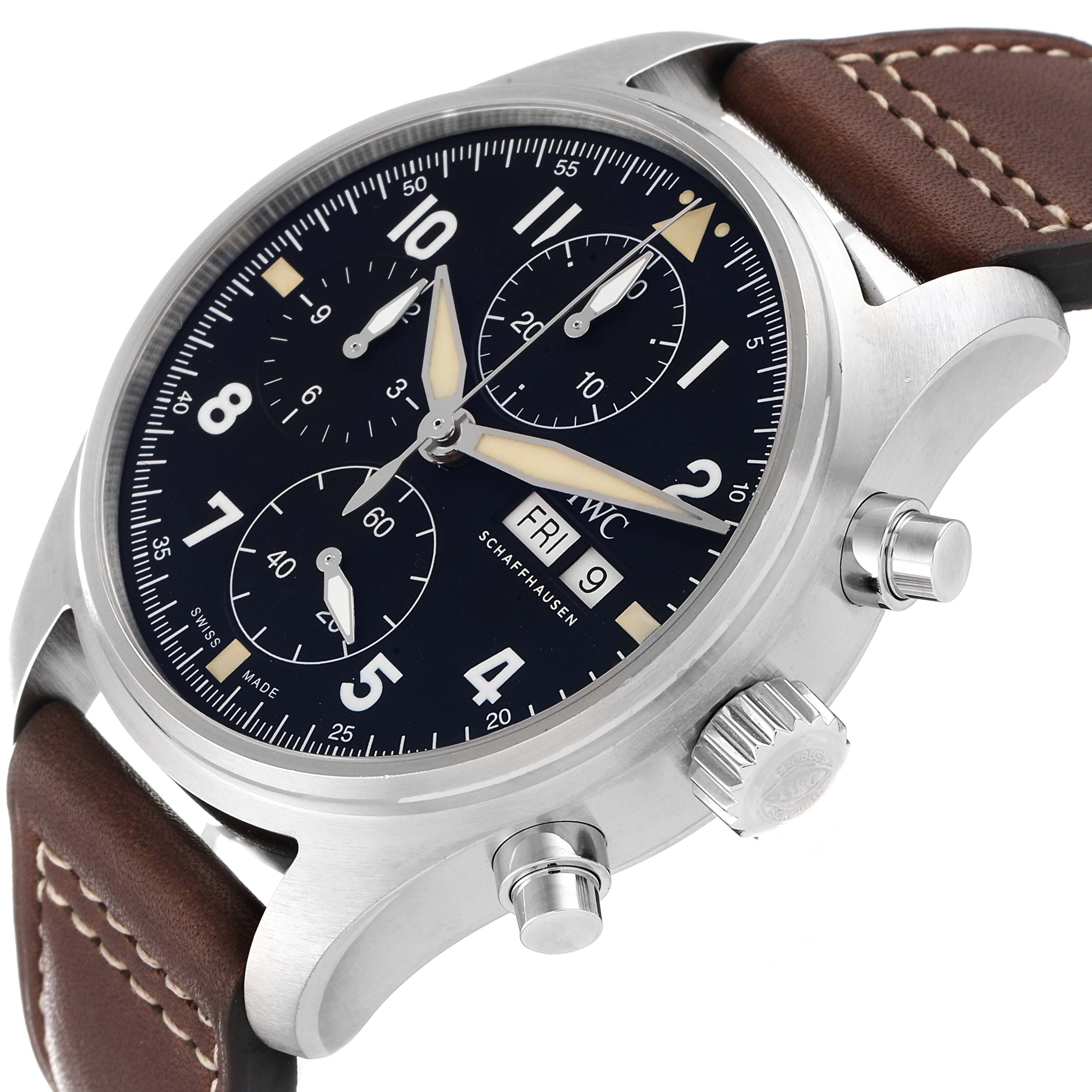The IWC Pilot IW387903 Men
s Stainless Steel Black Dial IW387903 Men
s Stainless Steel Black Dial watch is shown at an angle highlighting its black dial, chronograph sub-dials, crown, pushers, and brown leather strap.