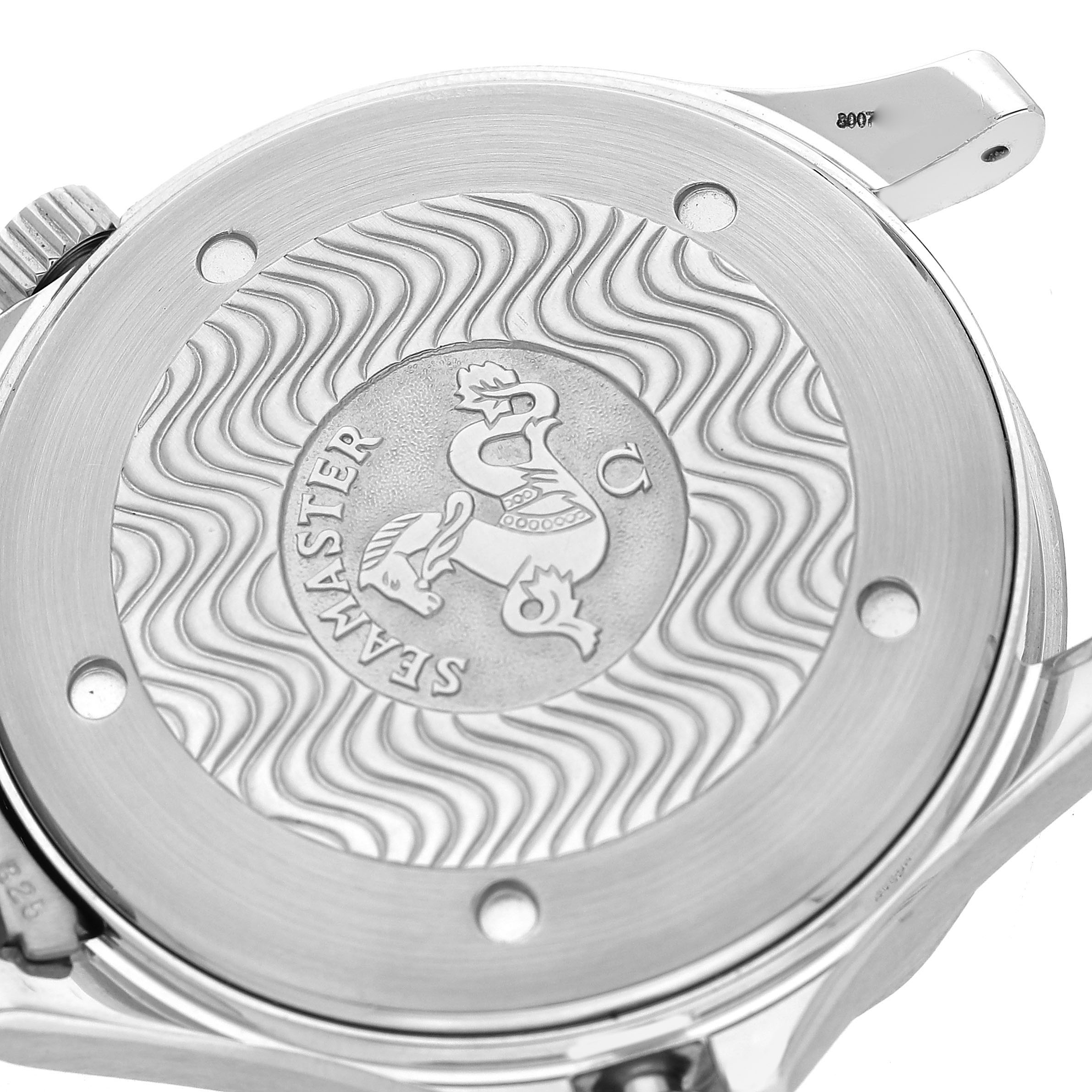 The image shows the back case of an Omega Seamaster 2531.80.00 Men's Stainless Steel Blue Dial watch, featuring engraved wave patterns and a central emblem.