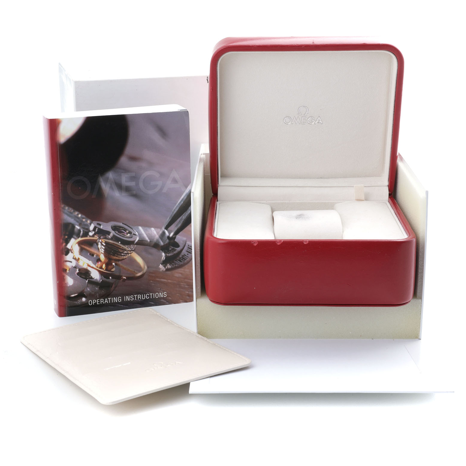 The image shows the box and accessories for the Omega Speedmaster 3310.10.00 Men's Steel and Gold (two tone) Champagne Dial, including an open case and instruction booklet.