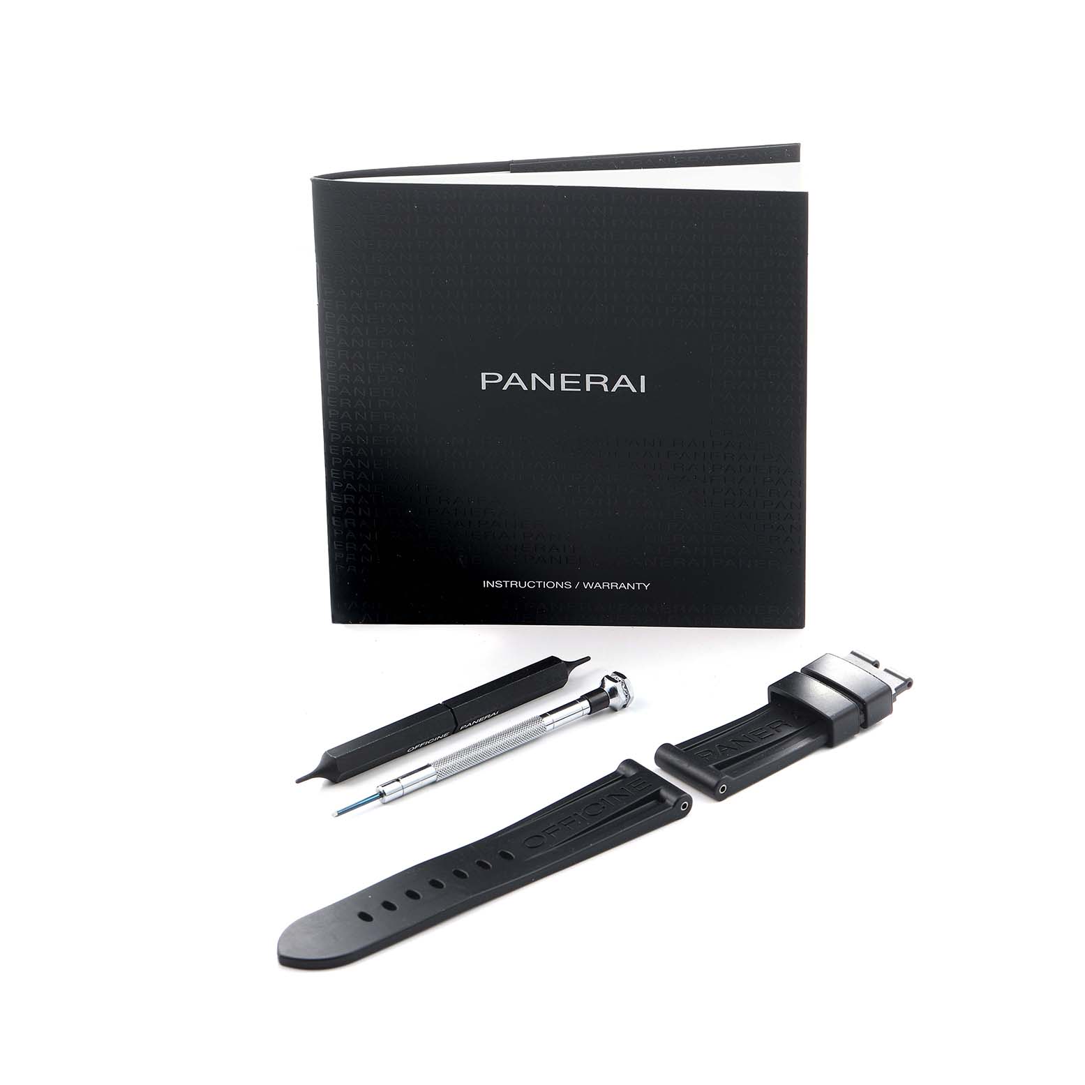 The image shows a Panerai Luminor PAM01441 Men's Ceramic Black Dial watch strap, tools, and an instruction booklet, viewed from above.