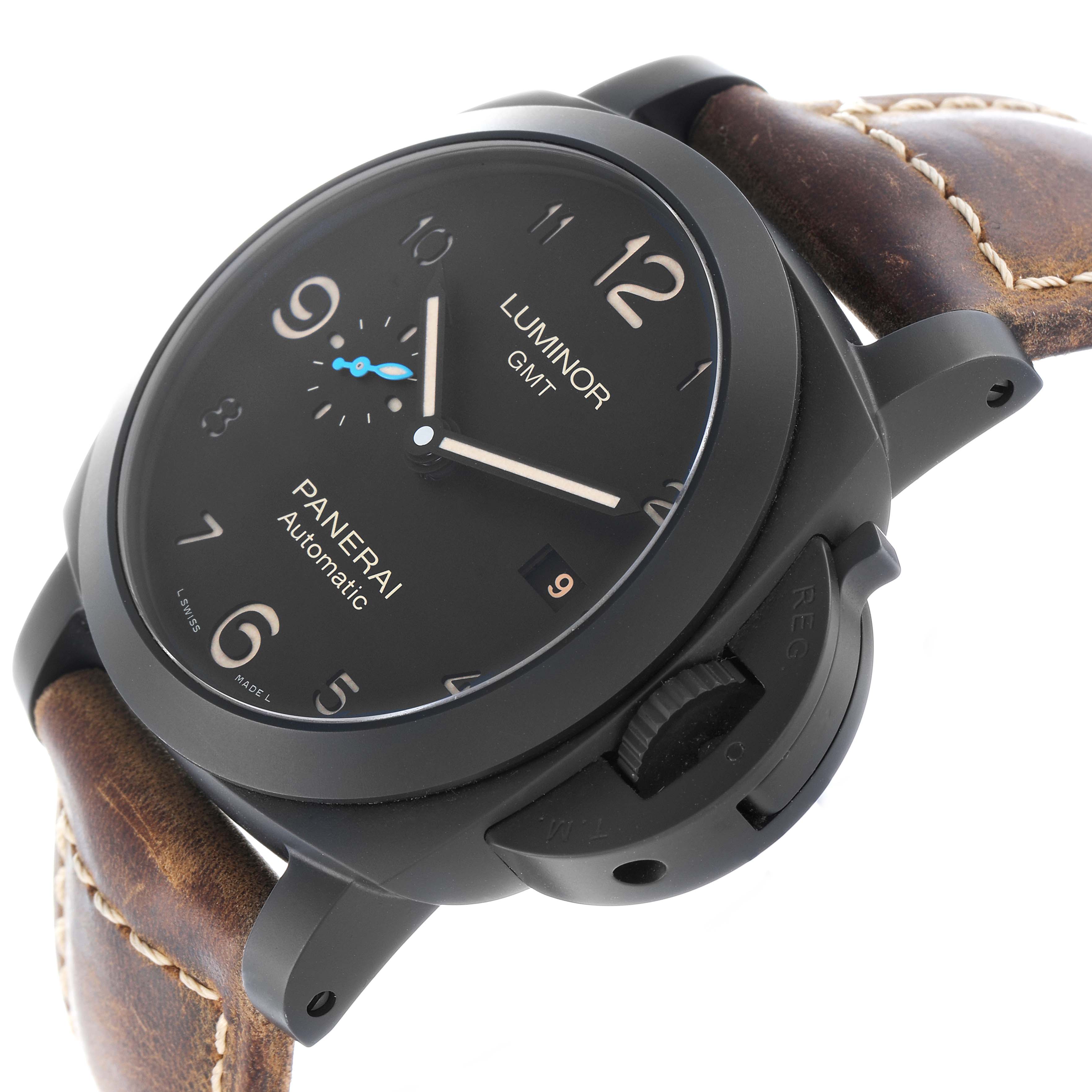 The image shows a Panerai Luminor PAM01441 Men's Ceramic Black Dial GMT watch at a slightly tilted angle, highlighting its dial, crown guard, and brown leather strap.