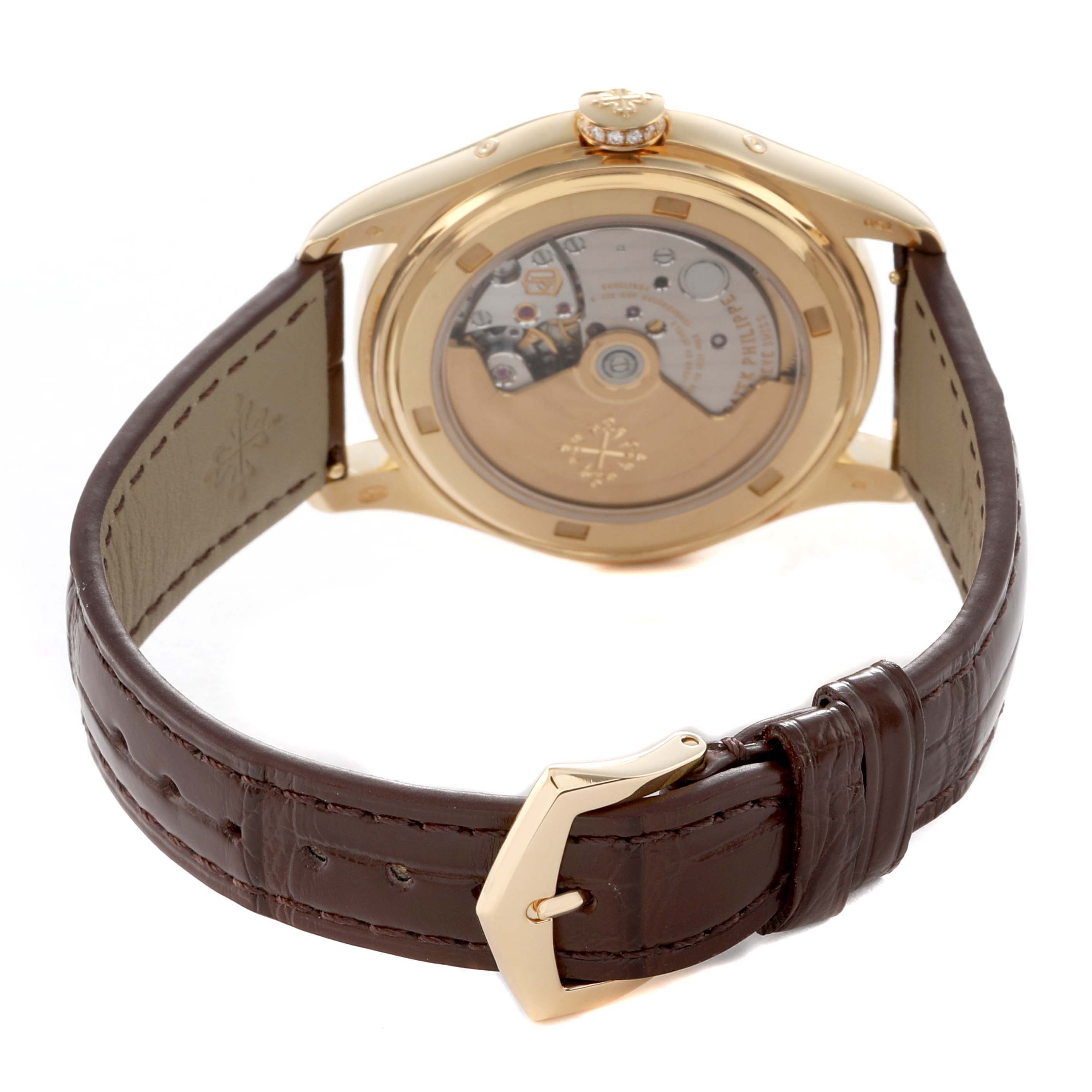 The image shows the back view of a Patek Philippe Complications 4936J - 001 Men's Yellow Gold Mother of Pearl Dial watch, highlighting the transparent case back and leather strap.