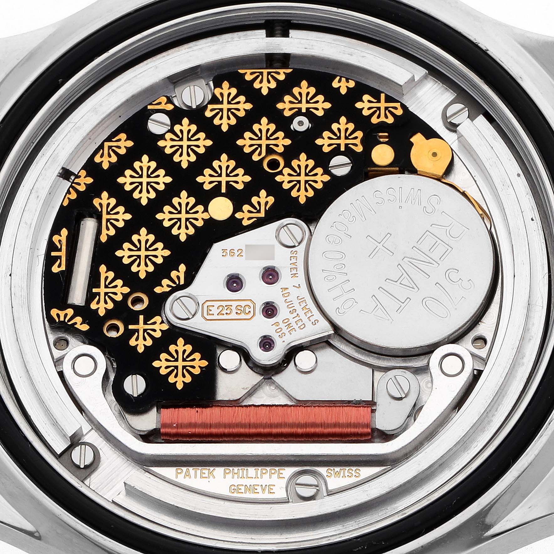 The image shows the movement of a Patek Philippe Aquanaut 5267A Women's Stainless Steel White Dial watch, highlighting the intricate mechanics and decorative elements.