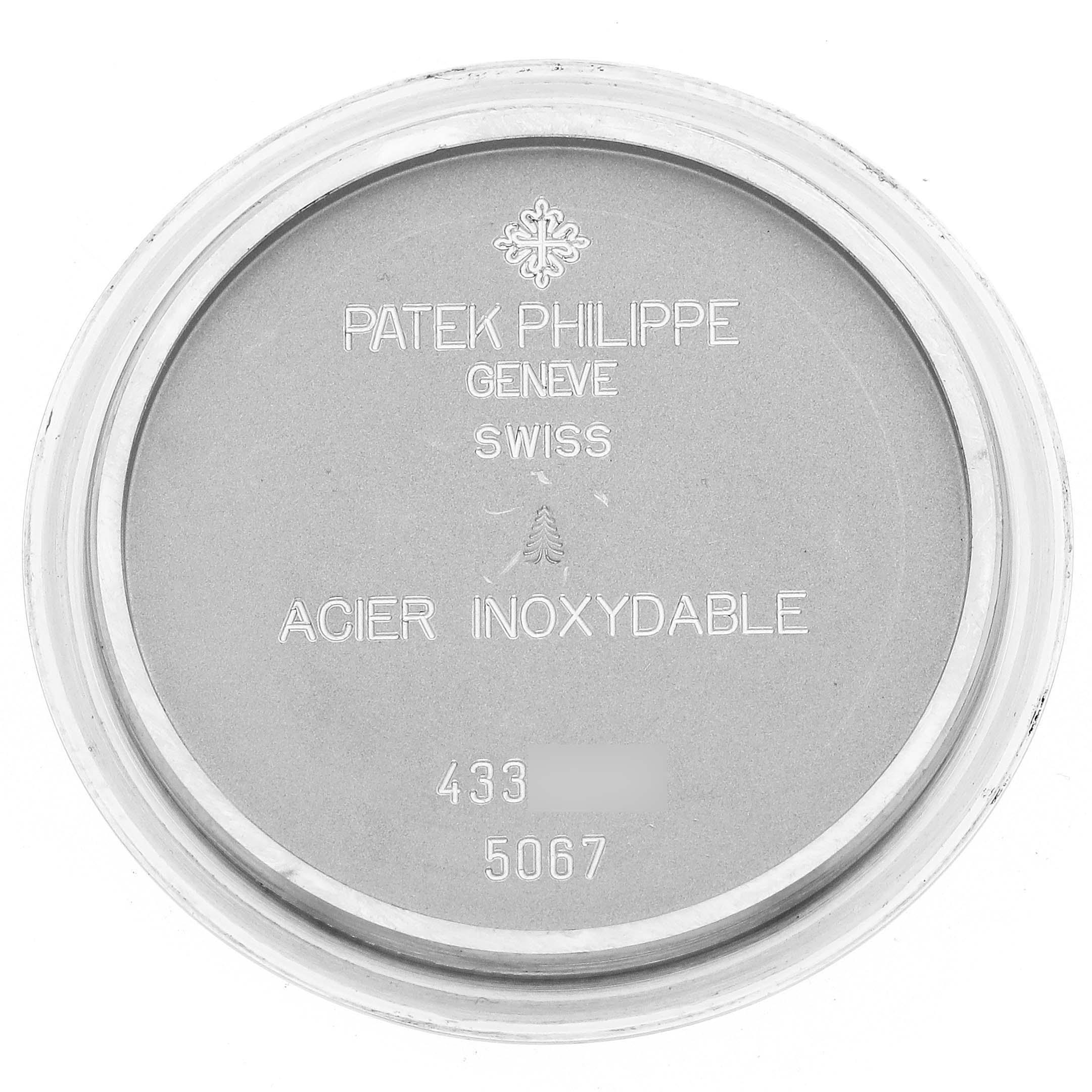 This image shows the inner case back of a Patek Philippe Aquanaut 5267A Women's Stainless Steel White Dial, engraved with branding and model details.