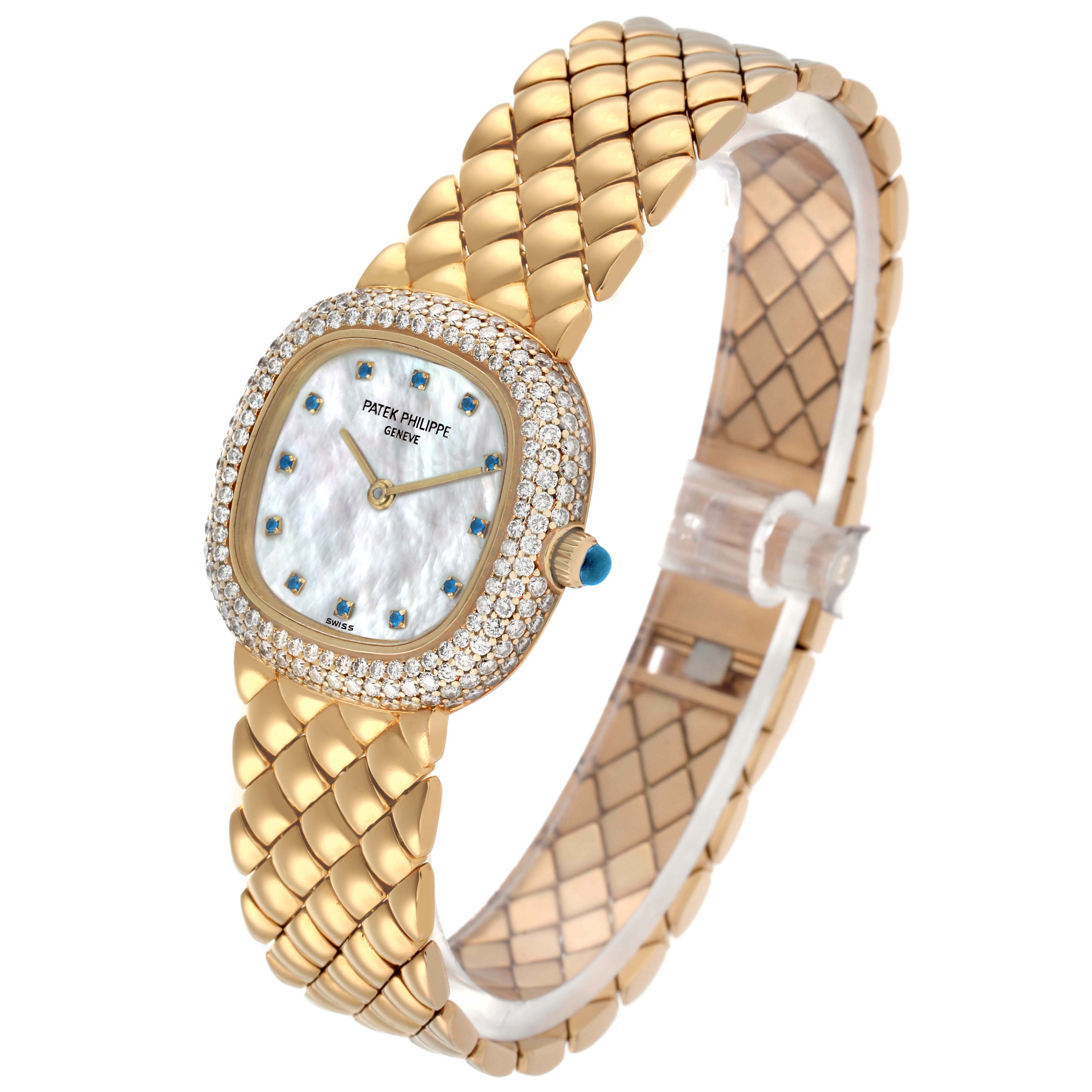The Patek Philippe Golden Ellipse 3848 Women's Yellow Gold Mother of Pearl Dial watch is shown at an angled view, displaying its gold bracelet, diamond-set bezel, and dial.