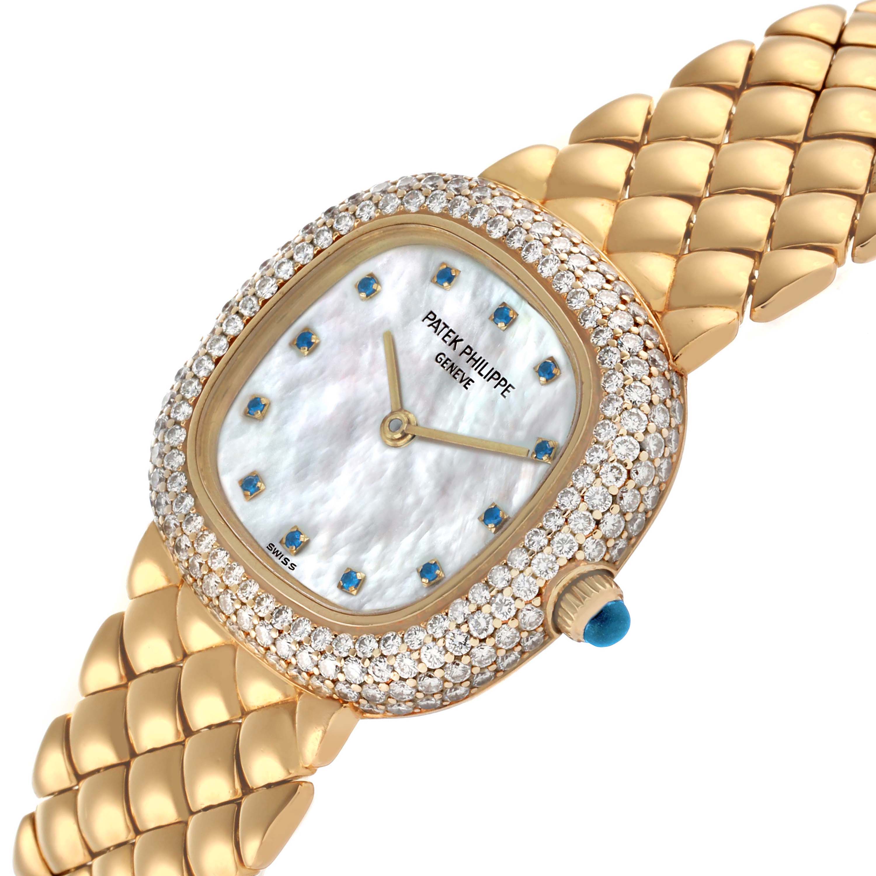 The Patek Philippe Golden Ellipse 3848 Women's Yellow Gold Mother of Pearl Dial watch is shown at an angled view featuring its diamond-encrusted bezel and gold bracelet.