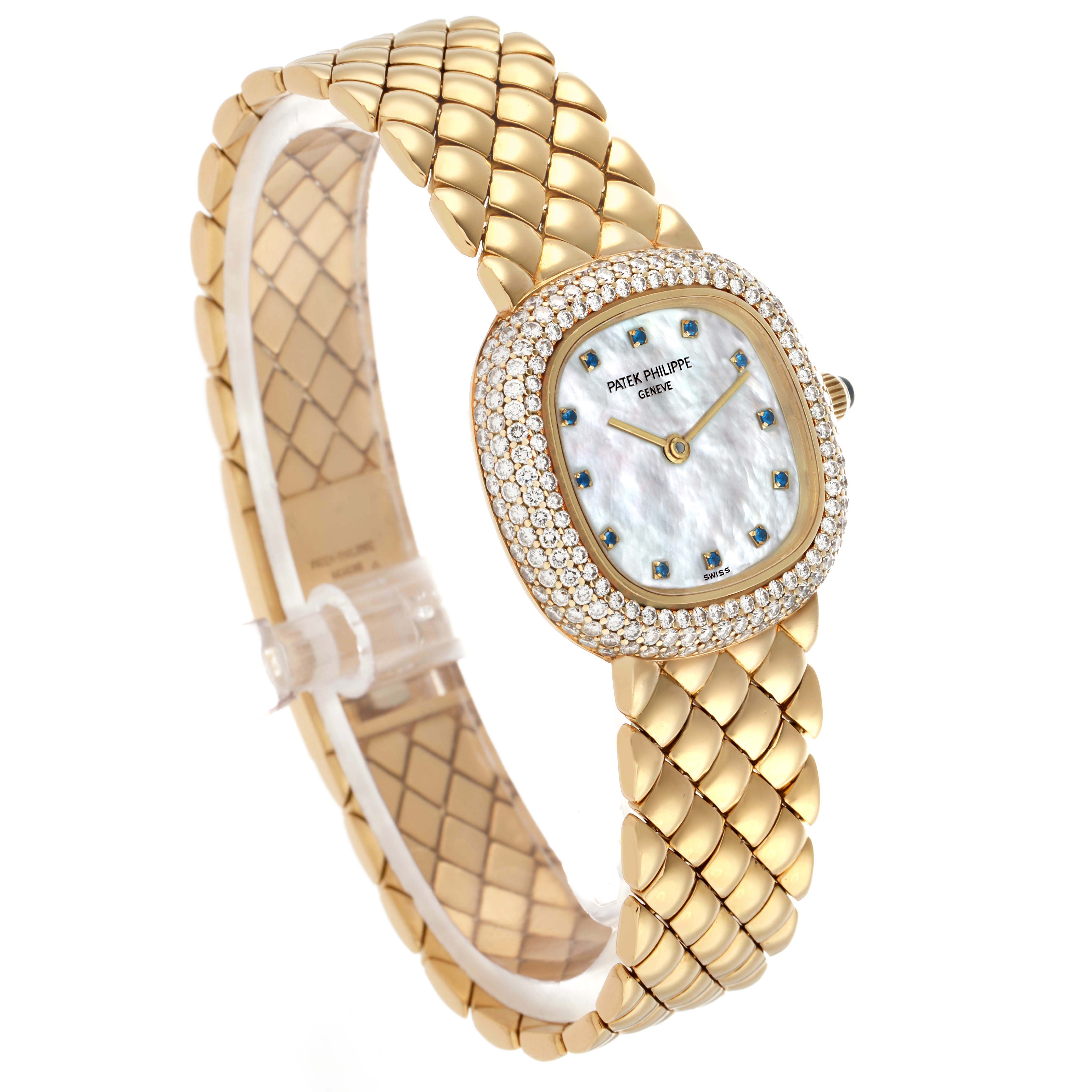 The Patek Philippe Golden Ellipse 3848 Women's Yellow Gold Mother of Pearl Dial watch is shown from an angled side view, displaying its dial, bezel, and bracelet.