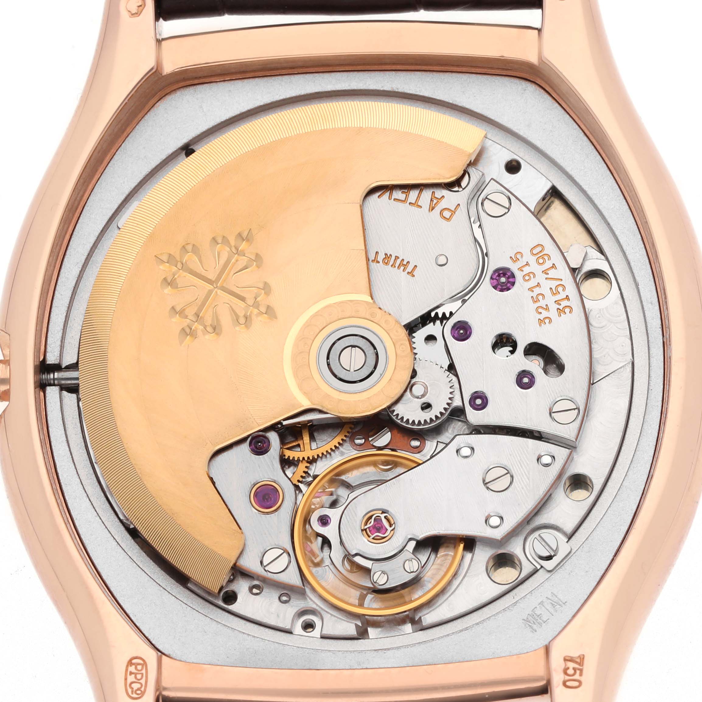 The image shows the movement of a Patek Philippe Gondolo 5030R Men's Rose Gold Silver Dial watch from a back view, highlighting the rotor and mechanical components.