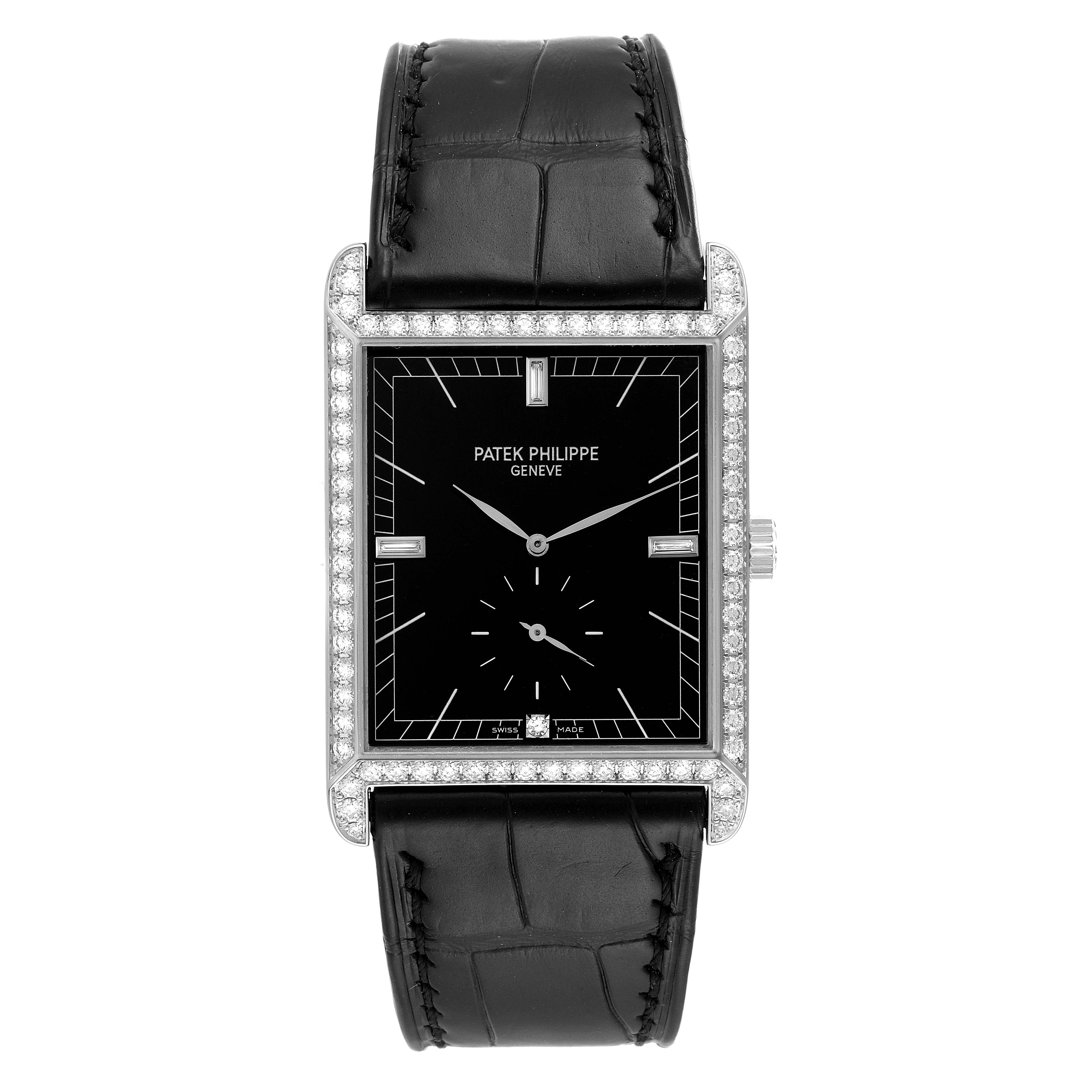 The image shows a Patek Philippe Gondolo 5112 Men's White Gold Black Dial 5112 Men's White Gold Black Dial watch from a top-down angle, highlighting its black leather strap and rectangular face with diamond accents.